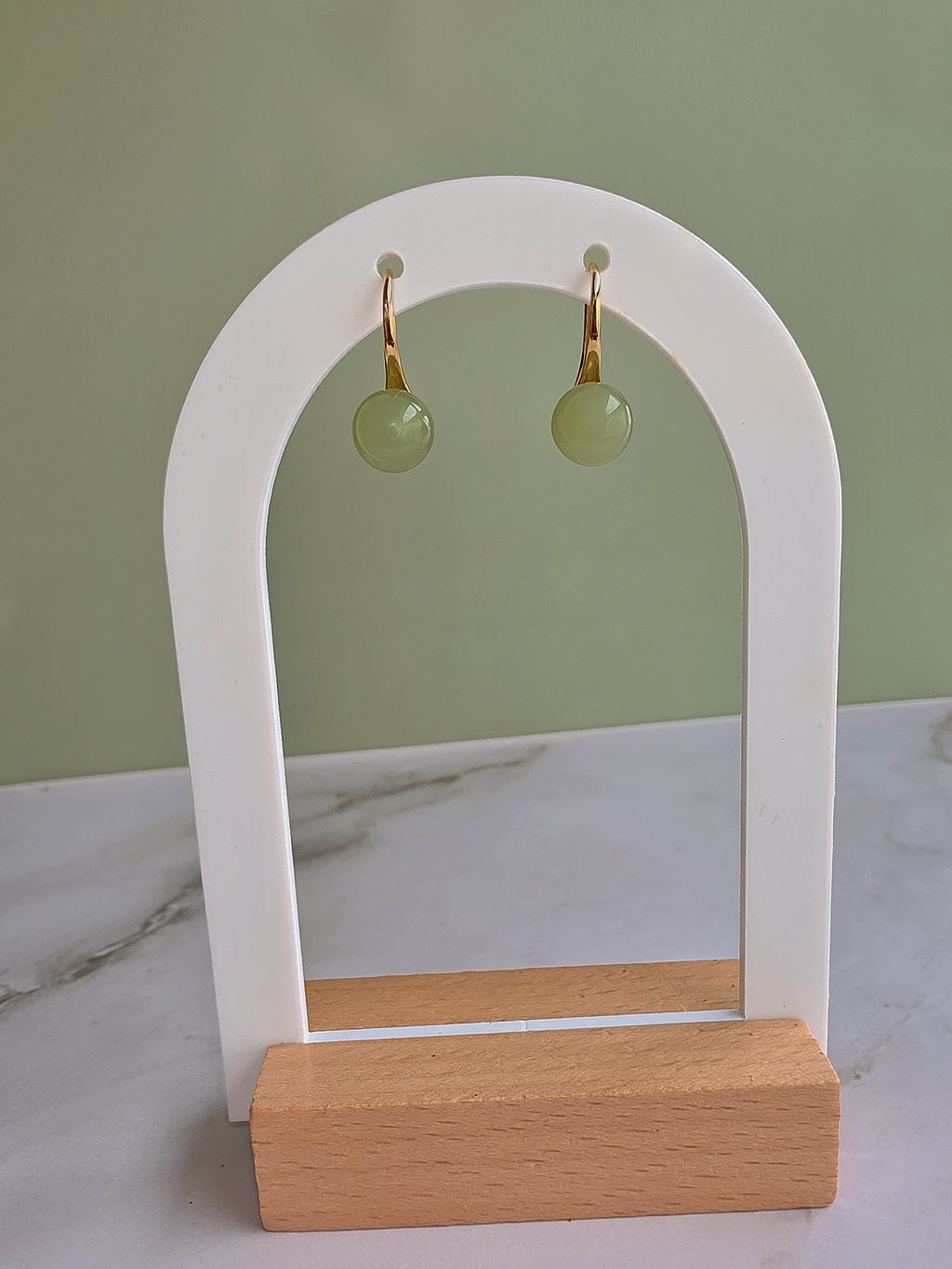 Minimalist jade gemstone earrings with a timeless gold-plated design.