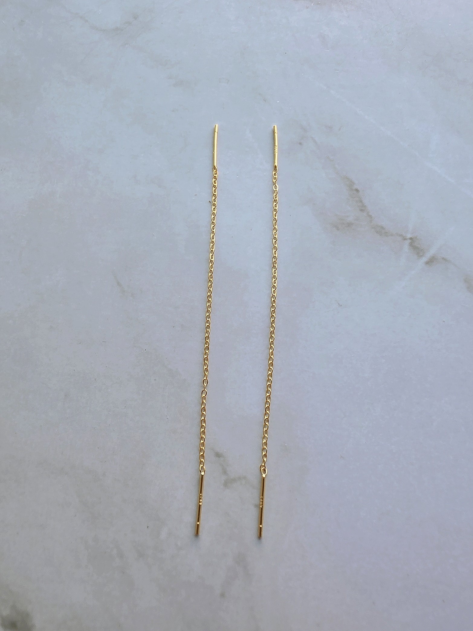 Elegant threader earrings with a delicate chain and straight bar drop.