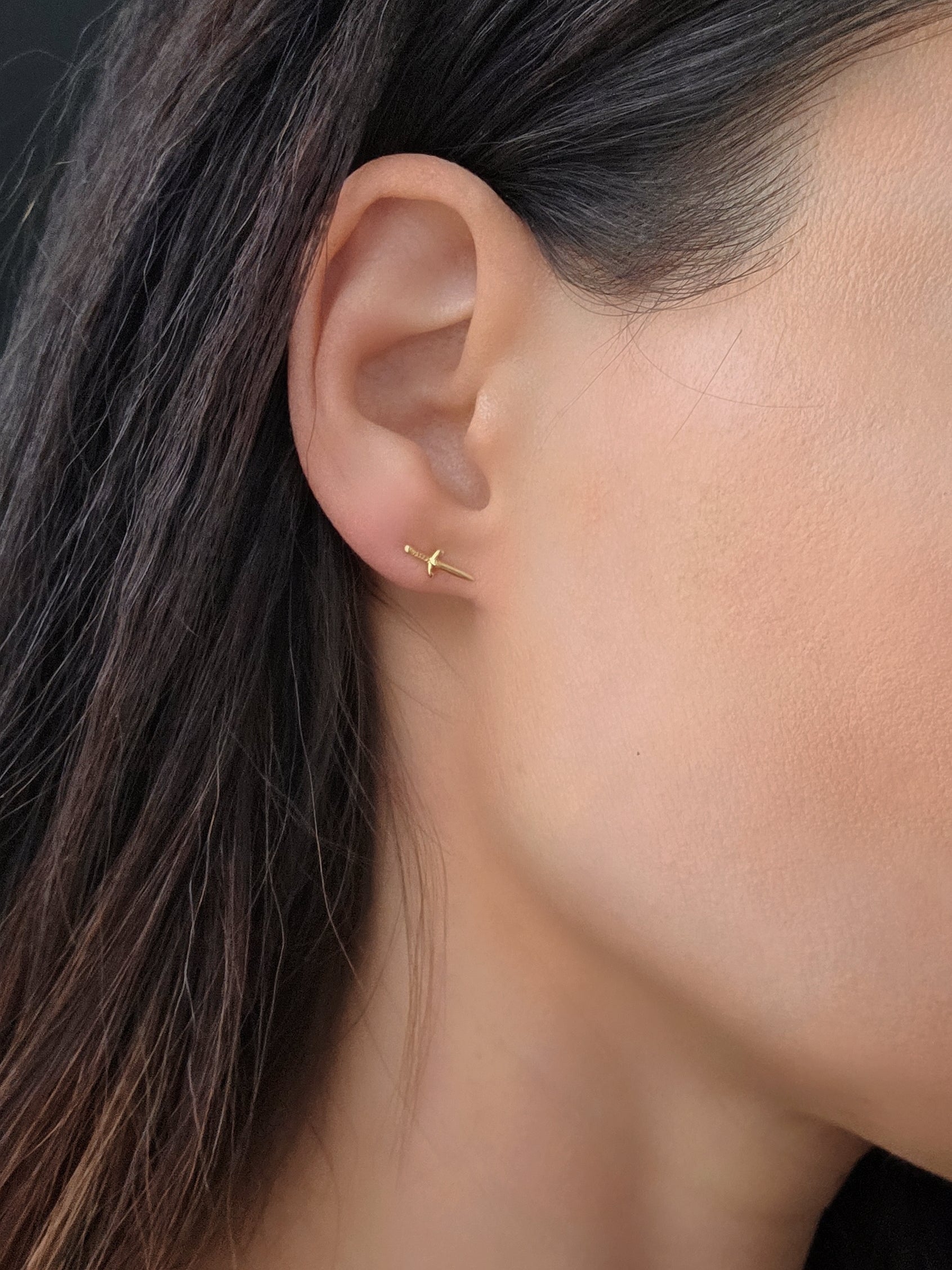 Minimalist dagger earrings featuring polished 18K gold-plated sterling silver.