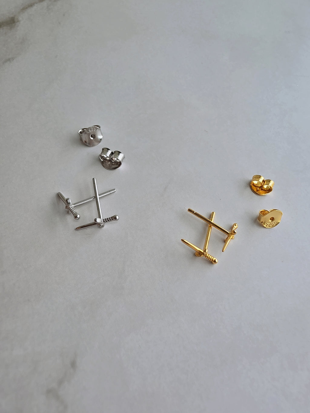 Women's minimalist dagger stud earrings for everyday wear.