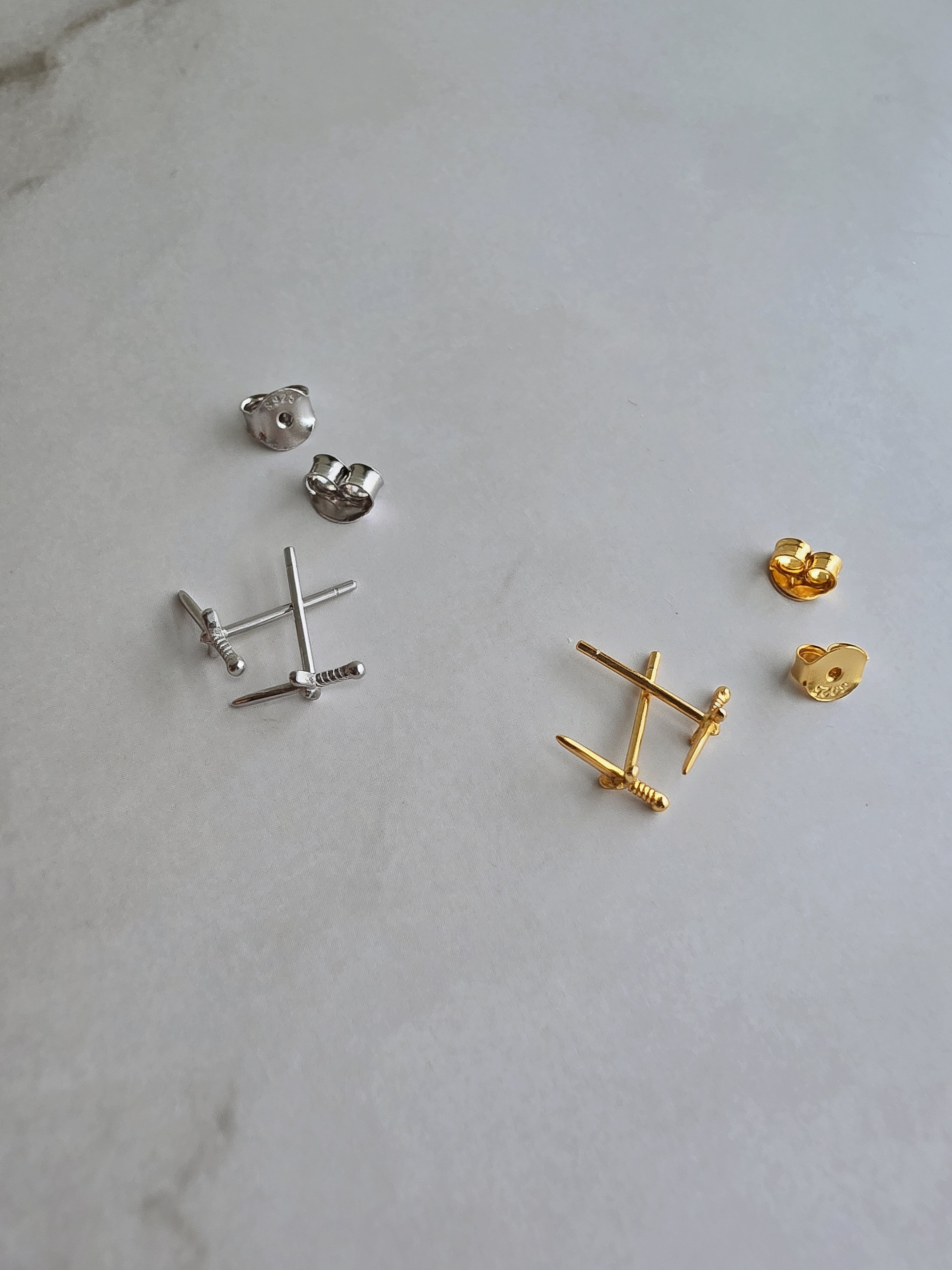 Women's minimalist dagger stud earrings for everyday wear.