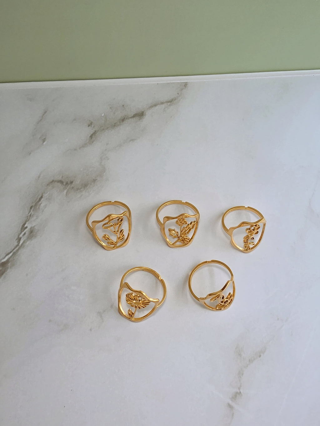 Floral statement ring inspired by birth flowers with a polished gold-plated finish.