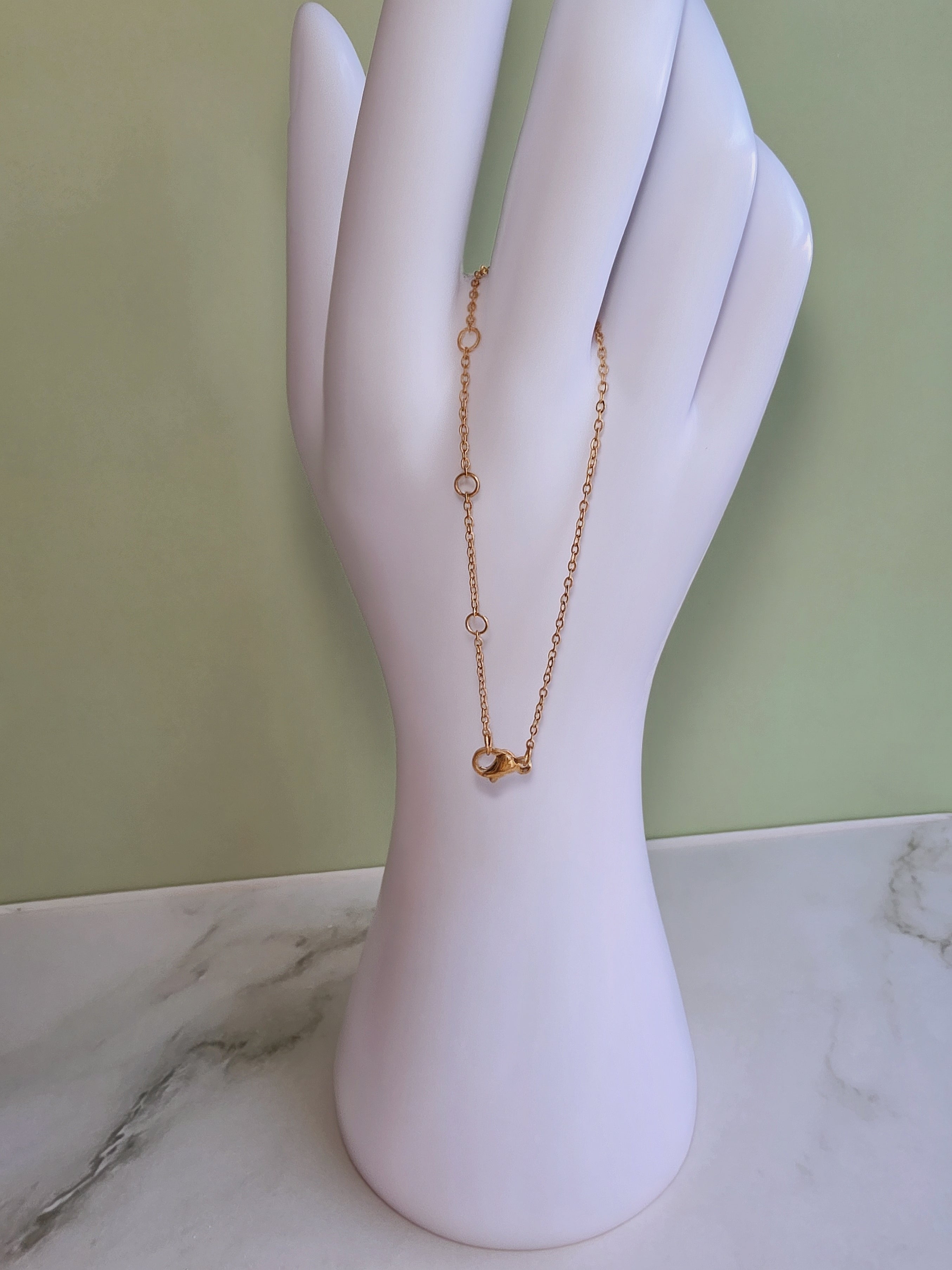 Gold crescent moon necklace crafted from stainless steel, perfect for everyday wear and gifting.