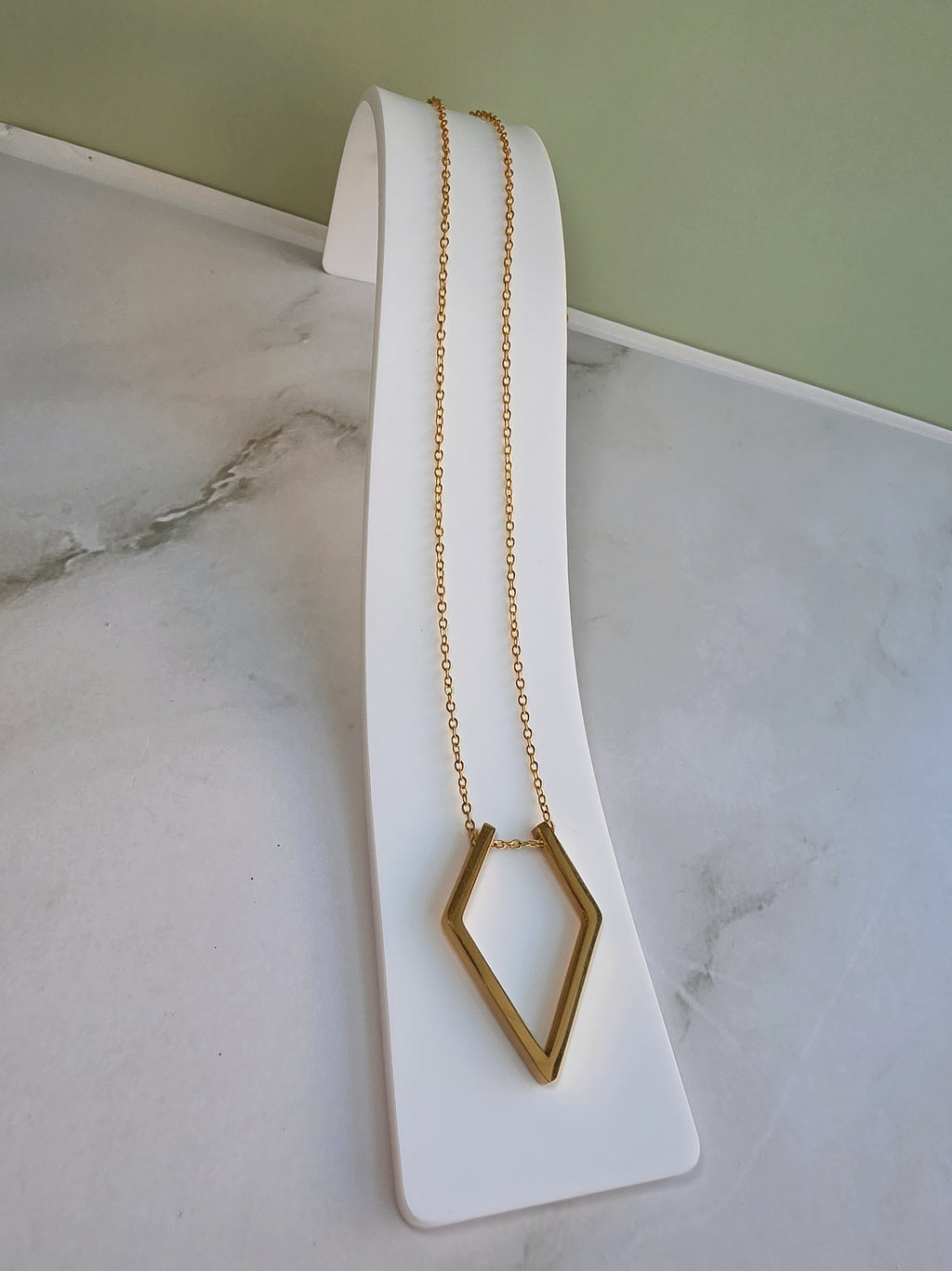 Necklace to hold your ring featuring a minimalist ring holder pendant.