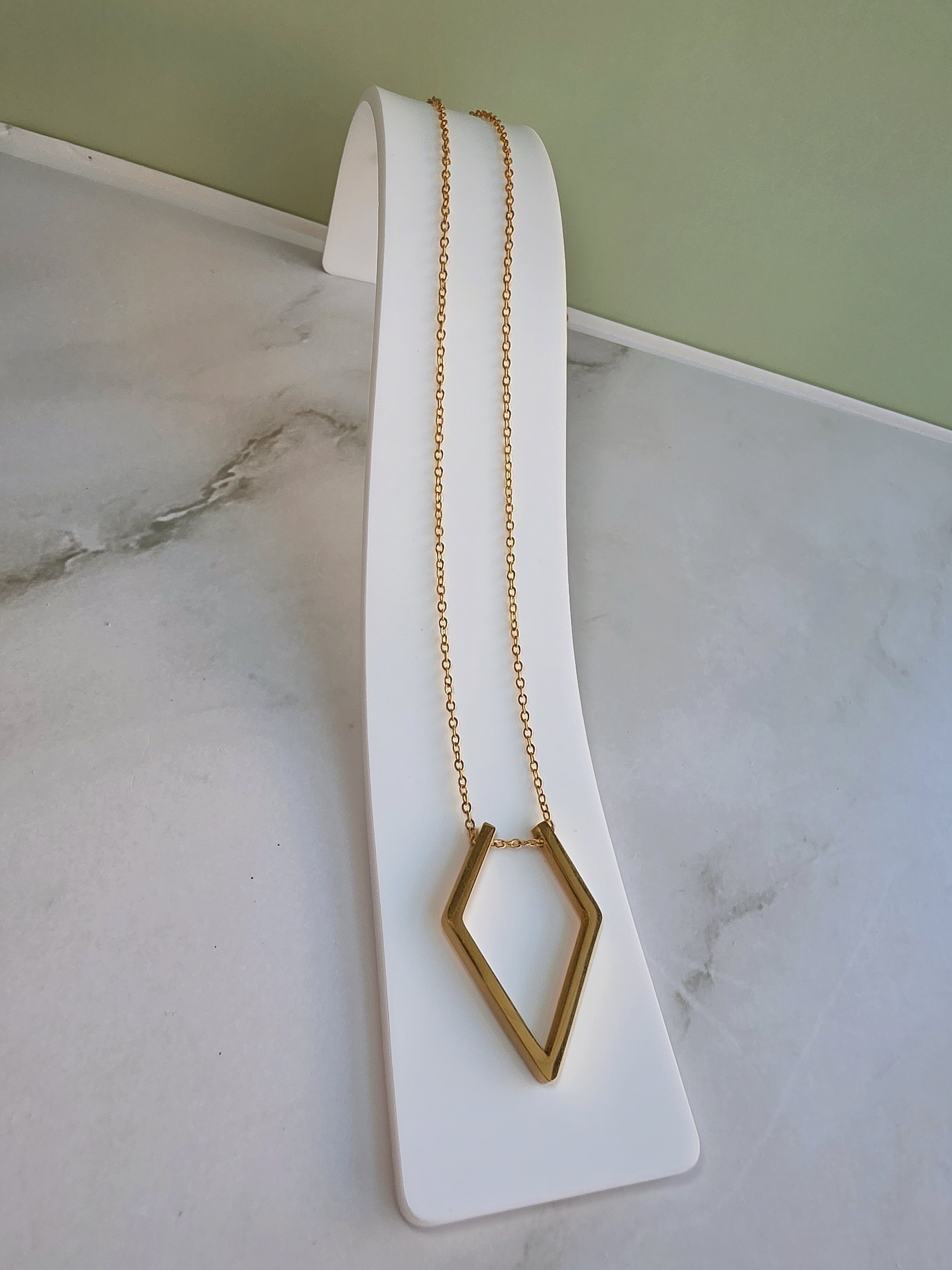 Necklace to hold your ring featuring a minimalist ring holder pendant.