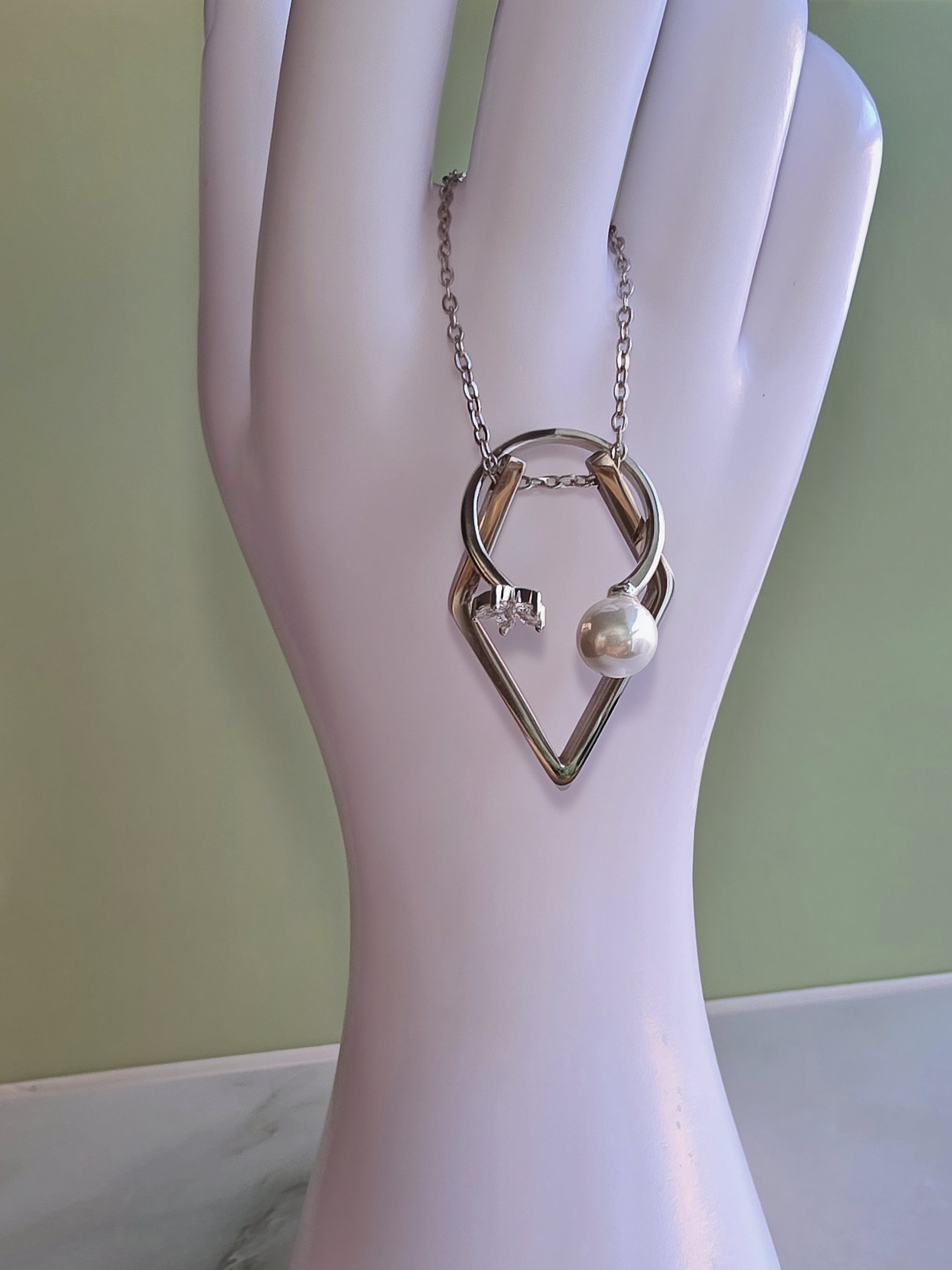 Elegant ring holder necklace for wedding and engagement rings.