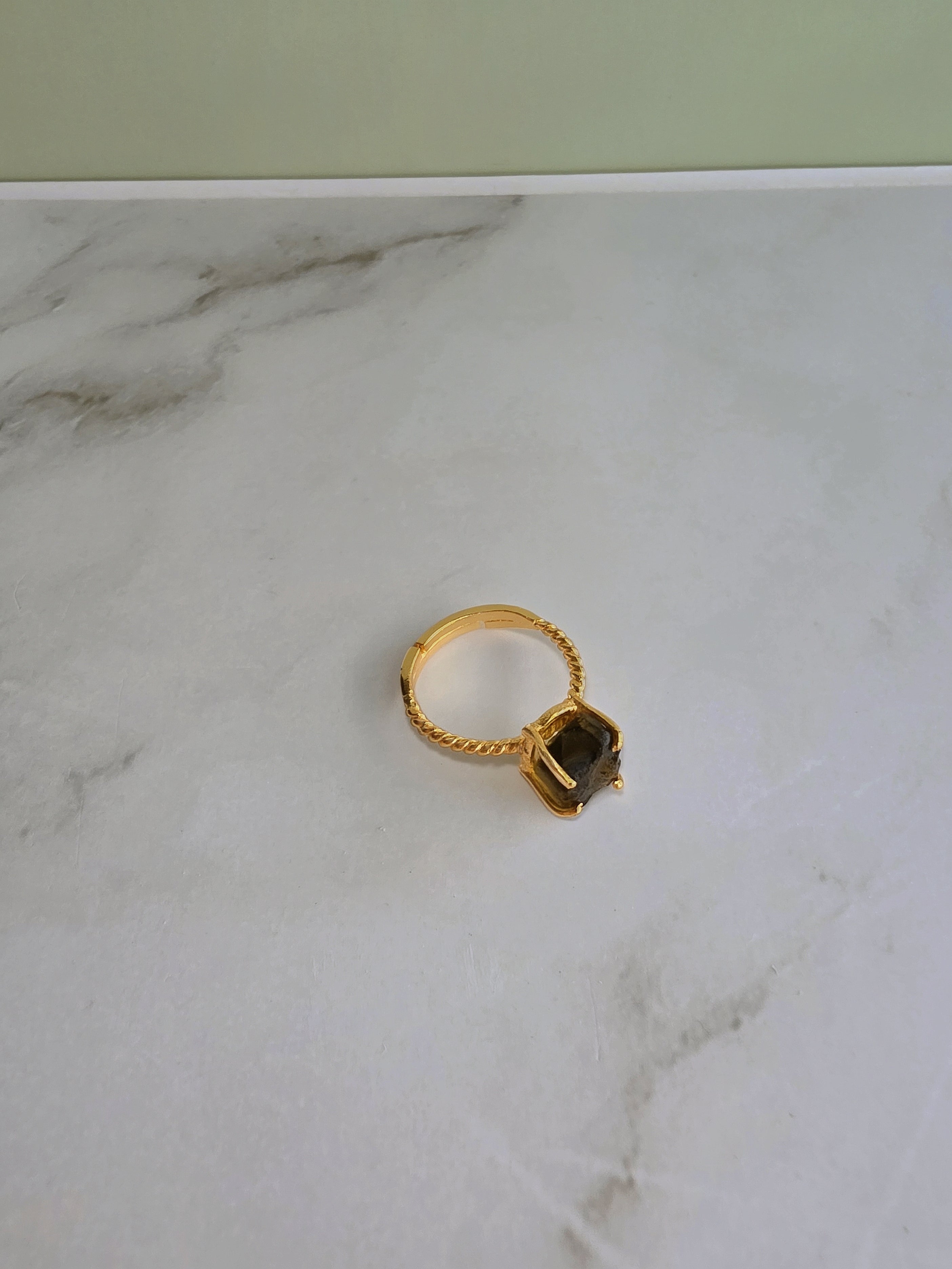 Handcrafted-style raw moldavite ring featuring a genuine natural green crystal.