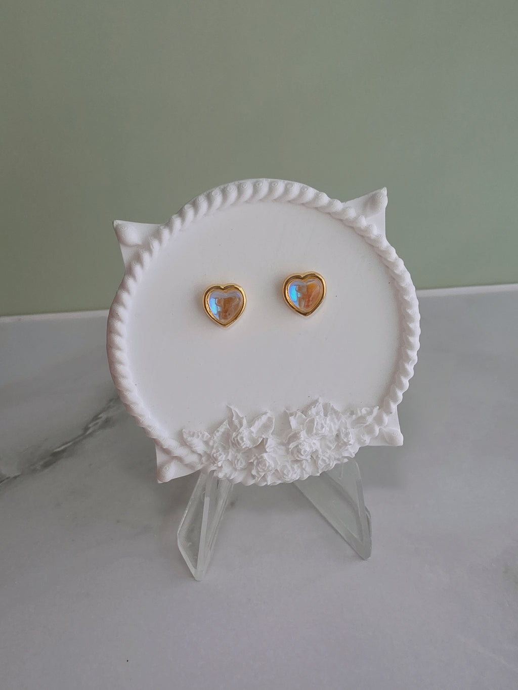 Elegant heart stud earrings with moonstone-style stones for women.