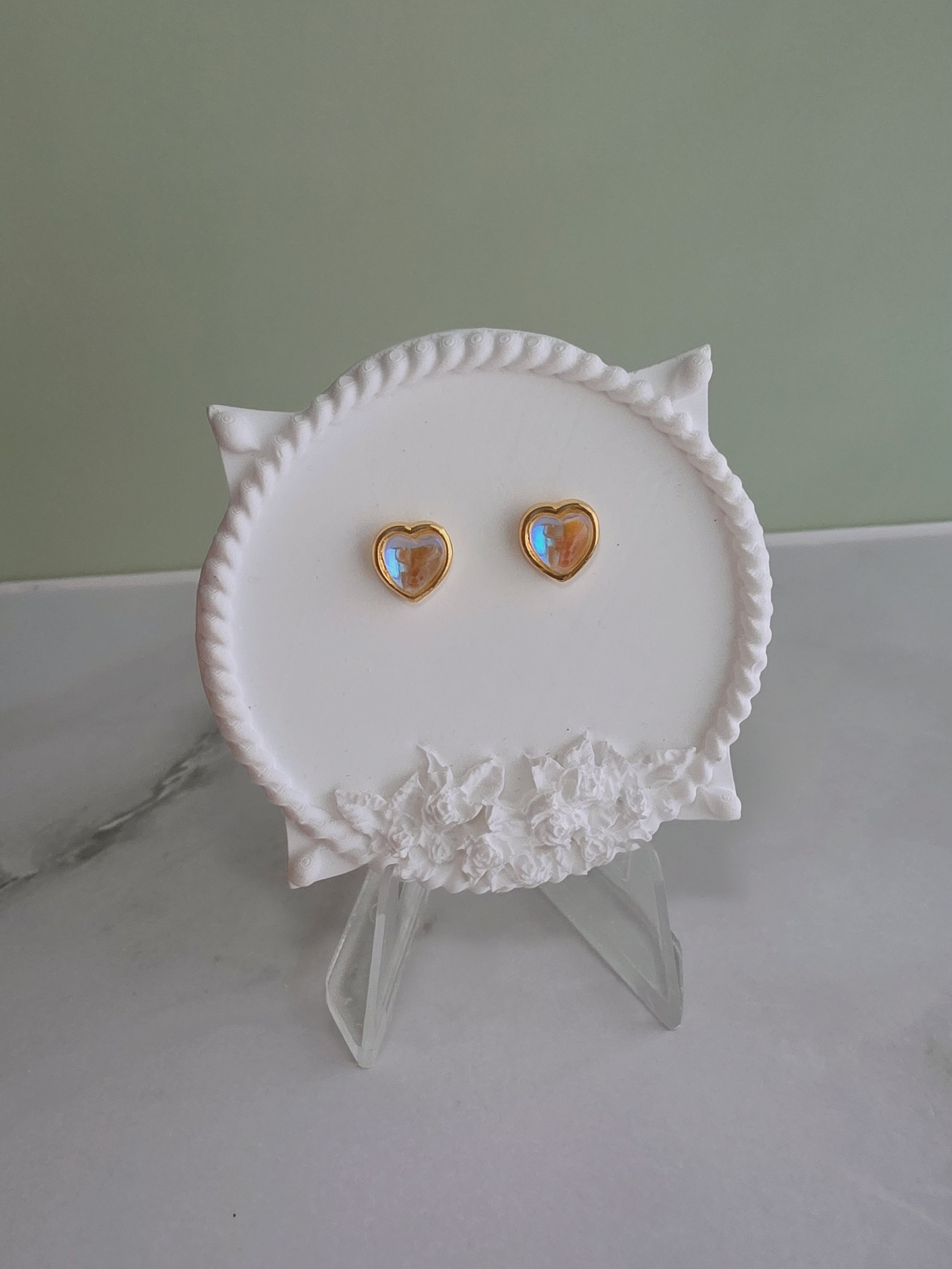 Elegant heart stud earrings with moonstone-style stones for women.