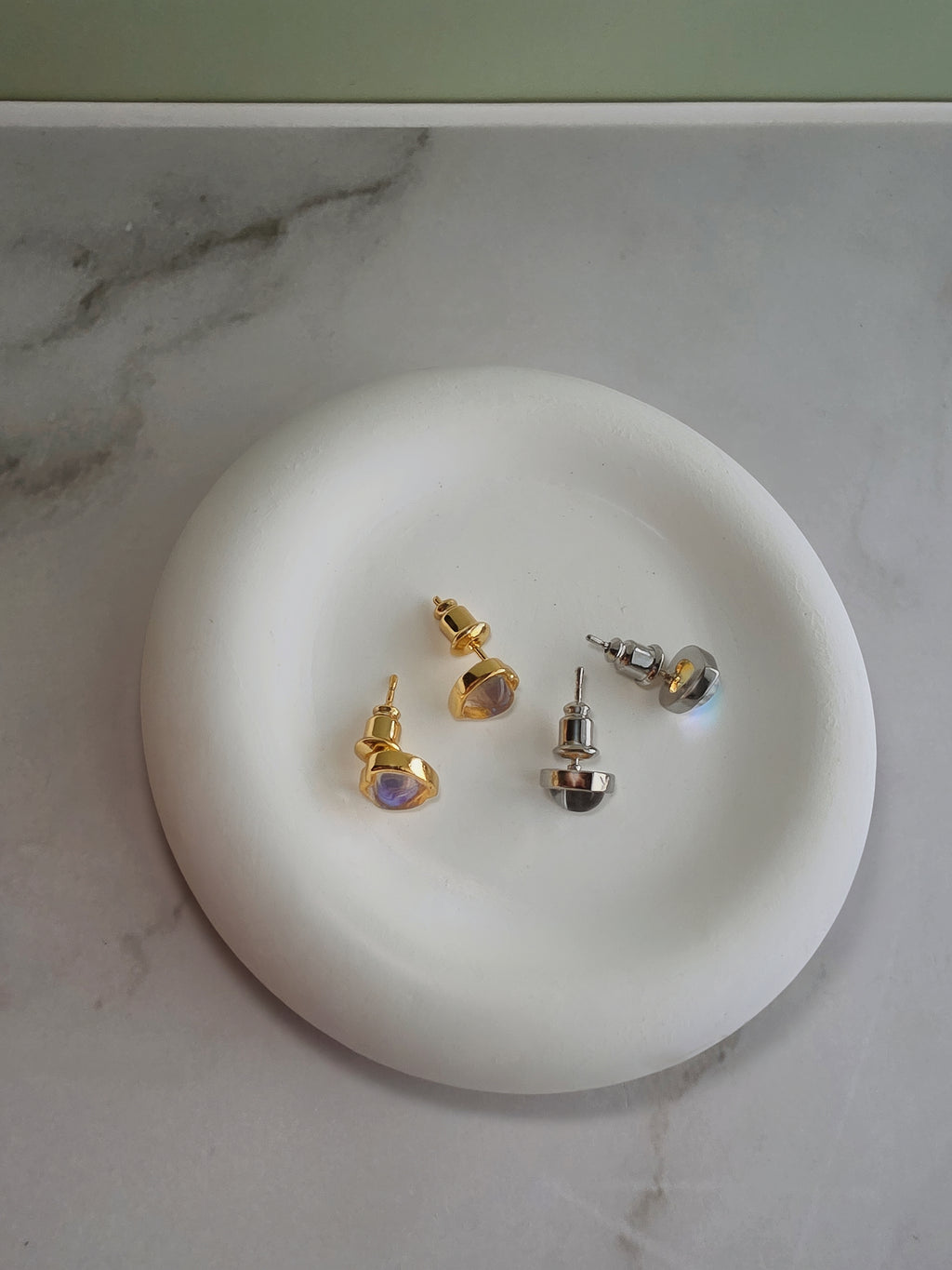 Cute heart moonstone earrings with a timeless gold-plated finish.