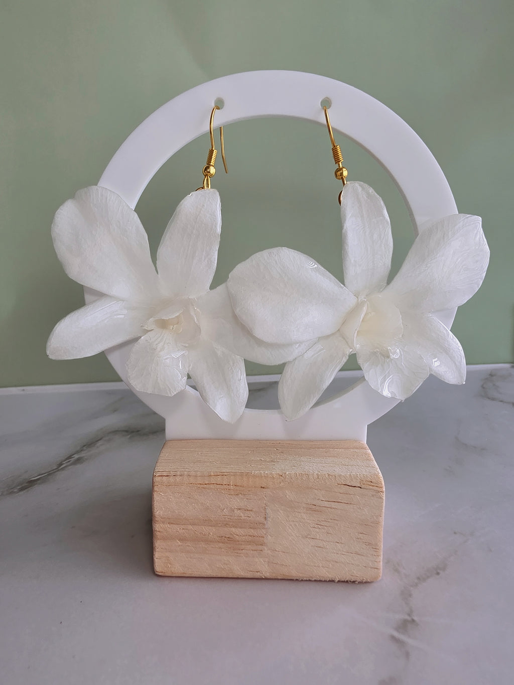 Elegant preserved orchid flower earrings crafted with 14K gold-plated hooks.