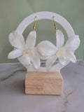 Elegant preserved orchid flower earrings crafted with 14K gold-plated hooks.