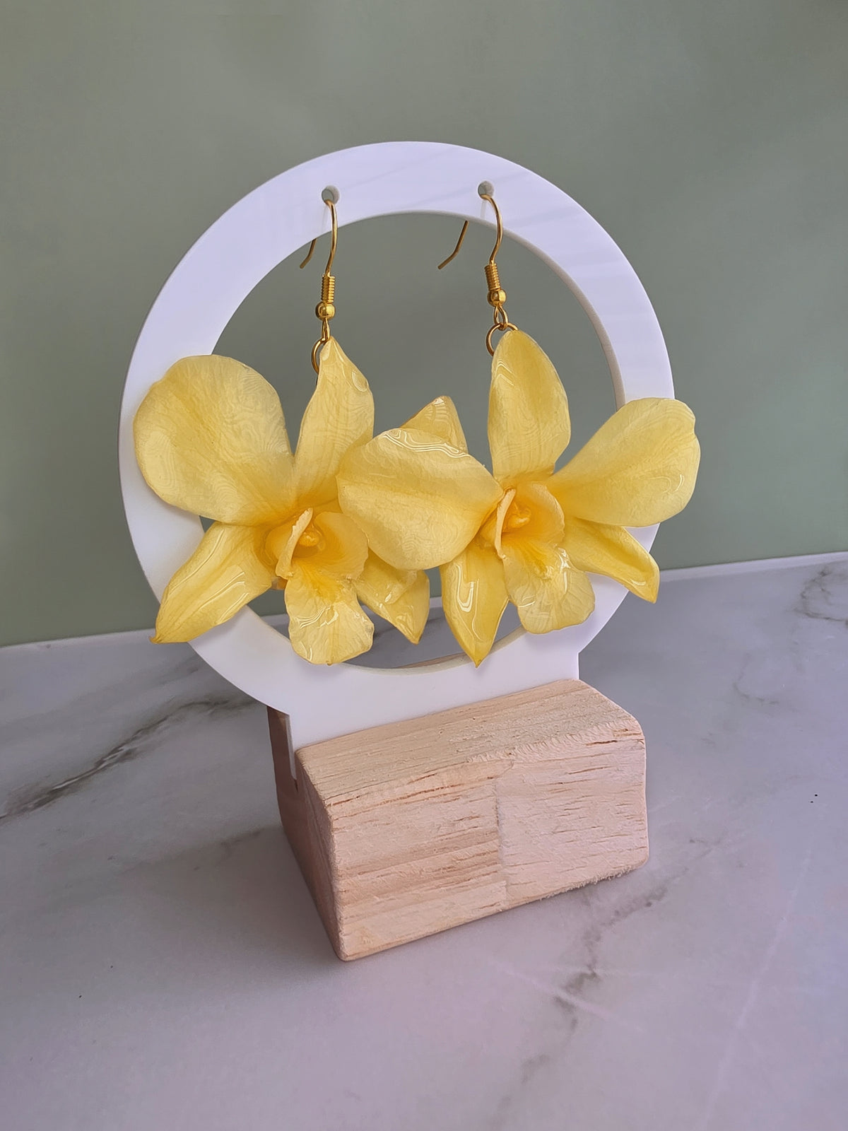 Elegant botanical earrings with real preserved orchid flowers.