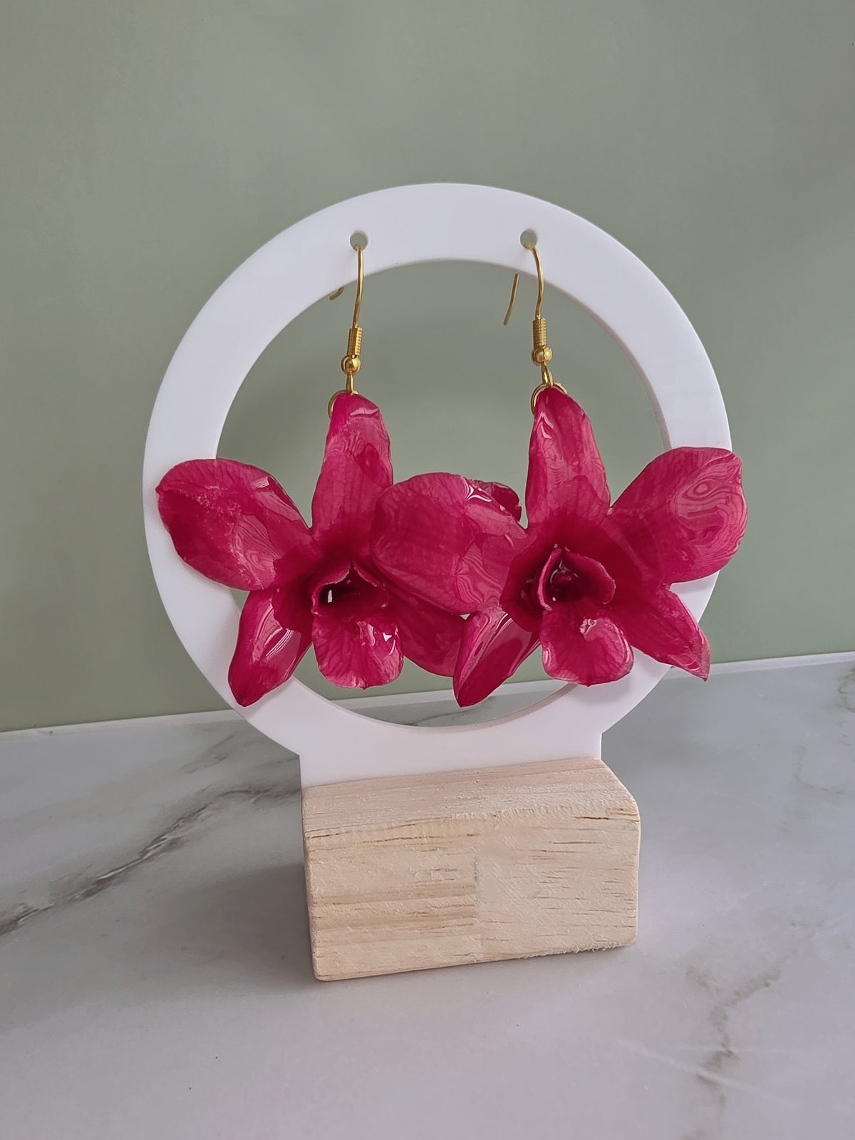 Nature-inspired orchid earrings featuring genuine preserved flowers.