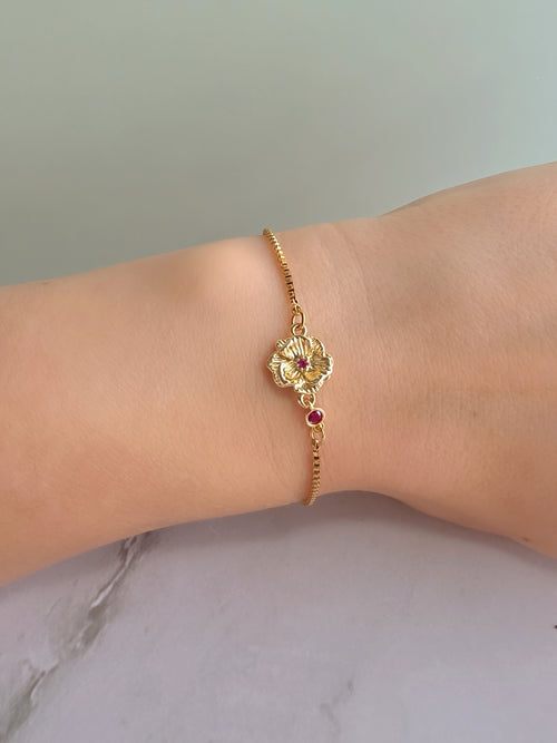 14K gold-plated birth flower bracelet featuring a birthstone accent.