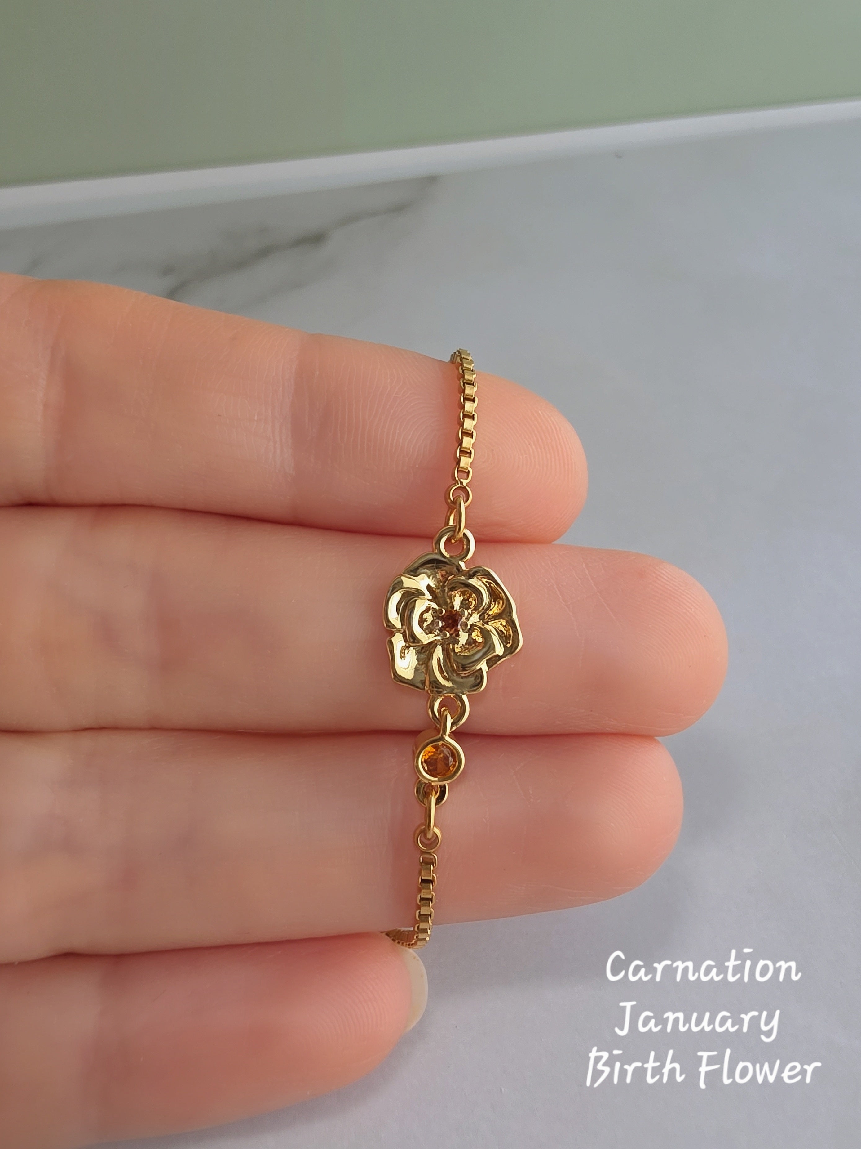 14K gold-plated birth flower bracelet featuring a birthstone accent.