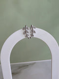 Nature-inspired botanical earrings with a graceful ear climbing design.