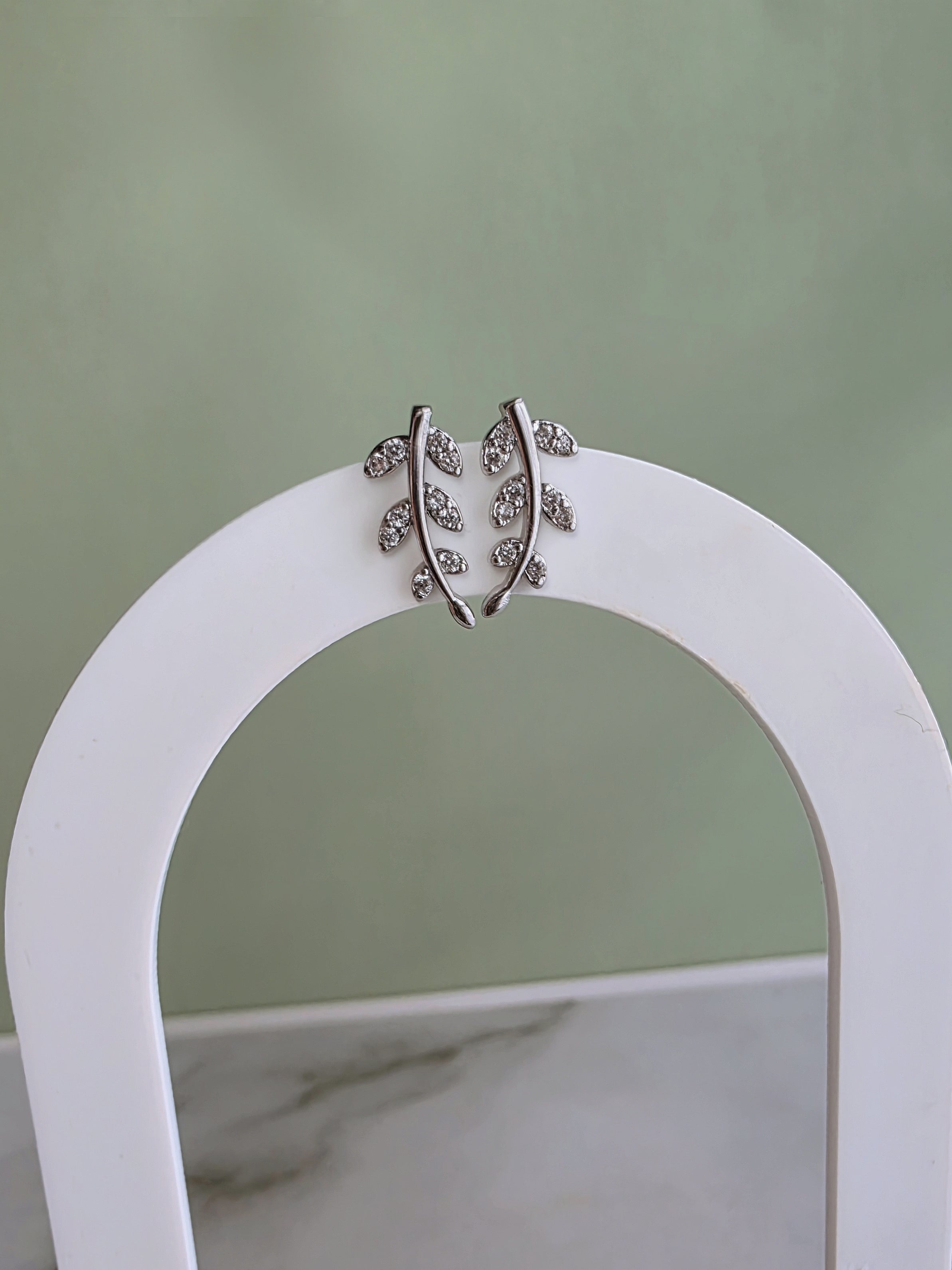 Nature-inspired botanical earrings with a graceful ear climbing design.