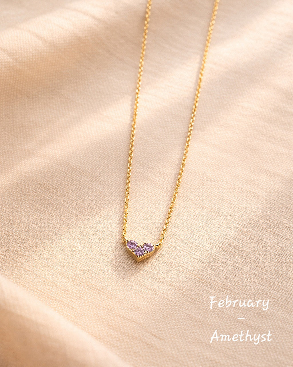 Heart-shaped birthstone necklace crafted from 925 sterling silver.