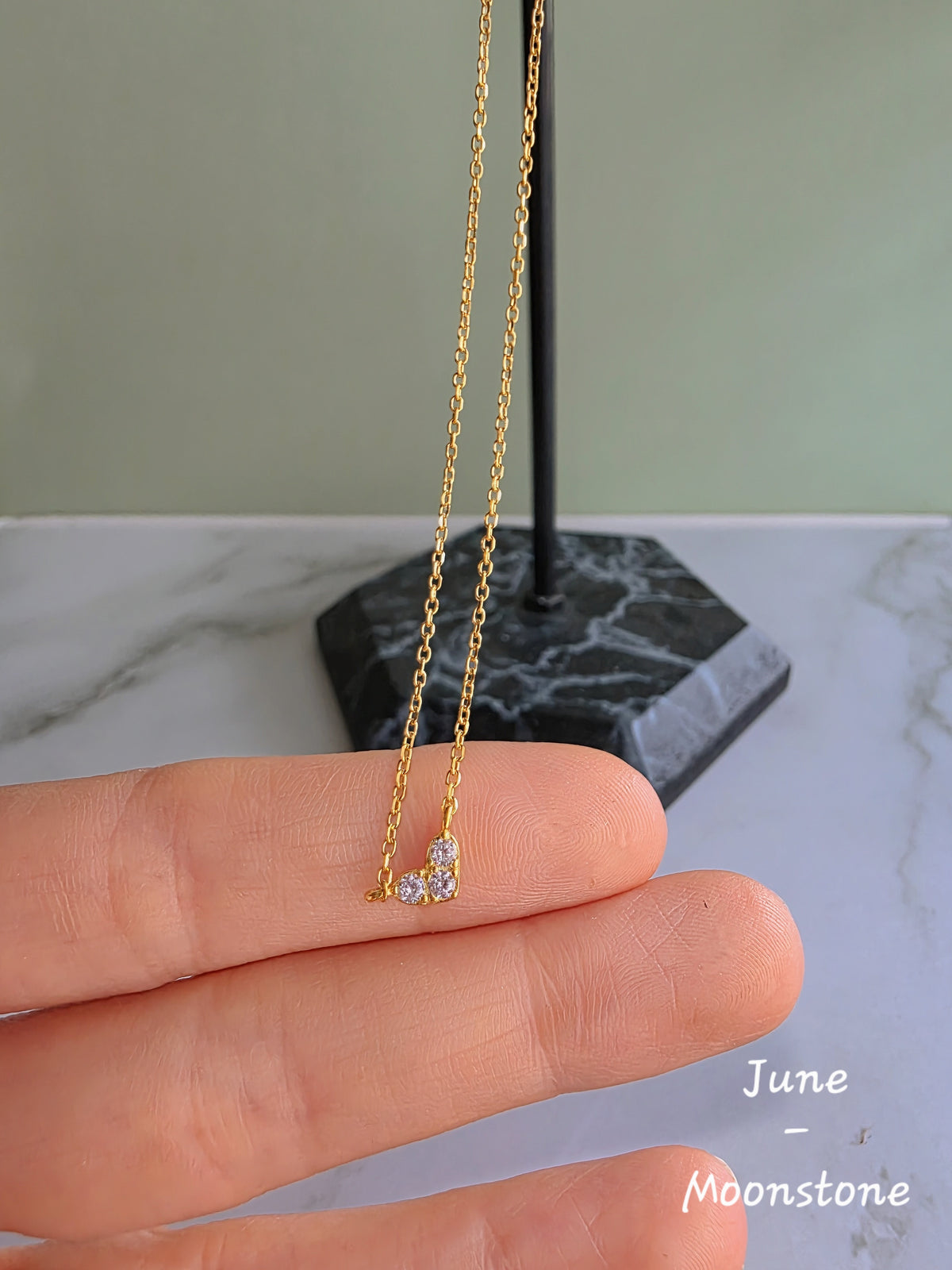 925 sterling silver necklace featuring a heart-shaped birthstone pendant.