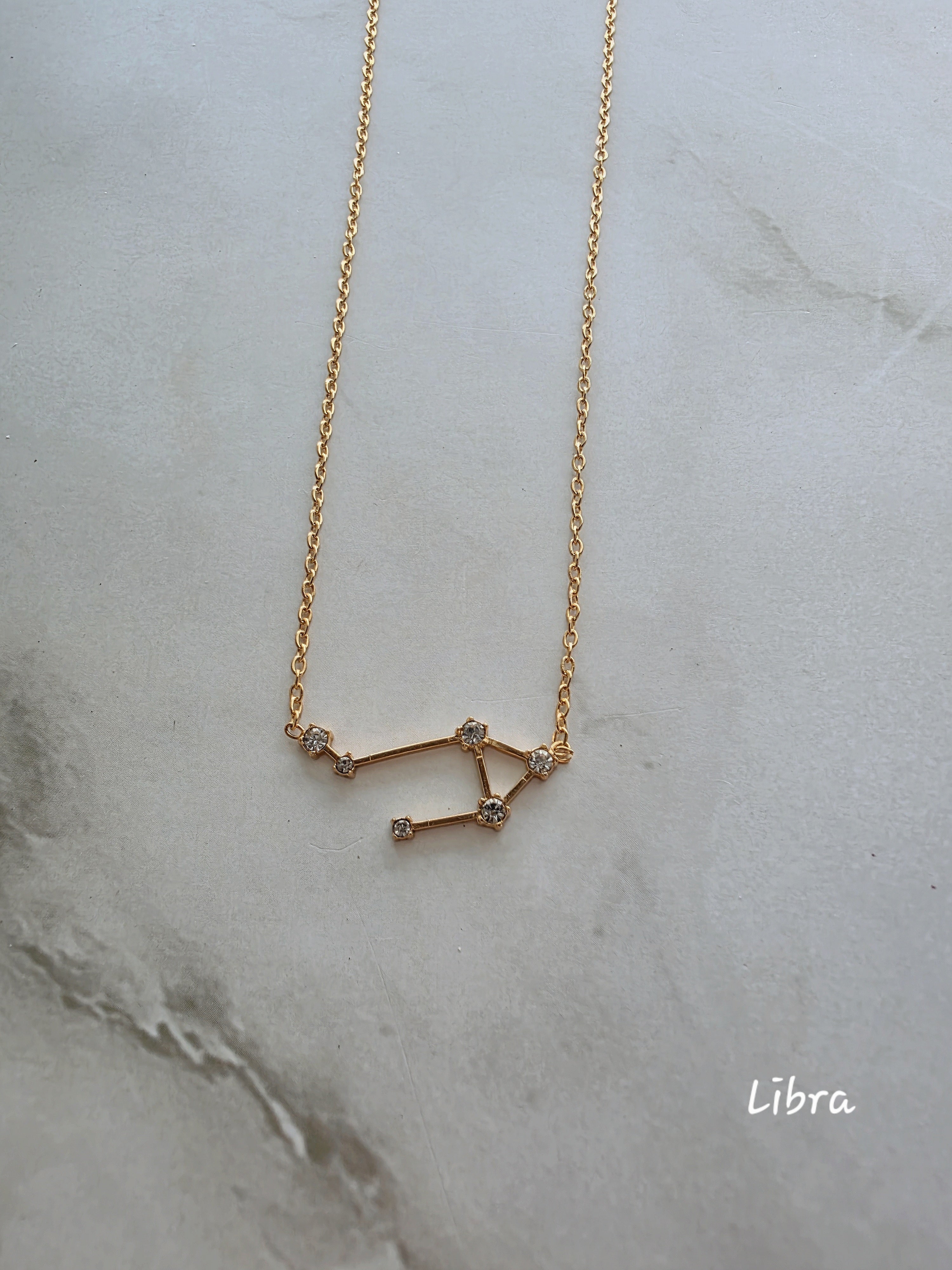 Elegant constellation necklace crafted from 18K gold-plated stainless steel.