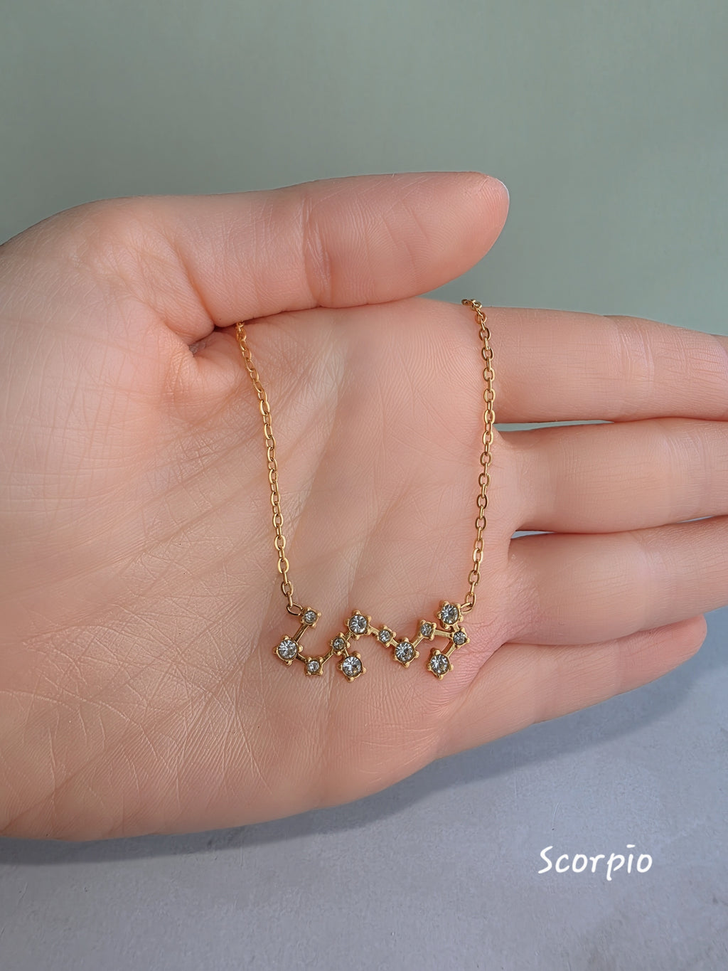 Astrology pendant necklace with a waterproof gold-plated finish.