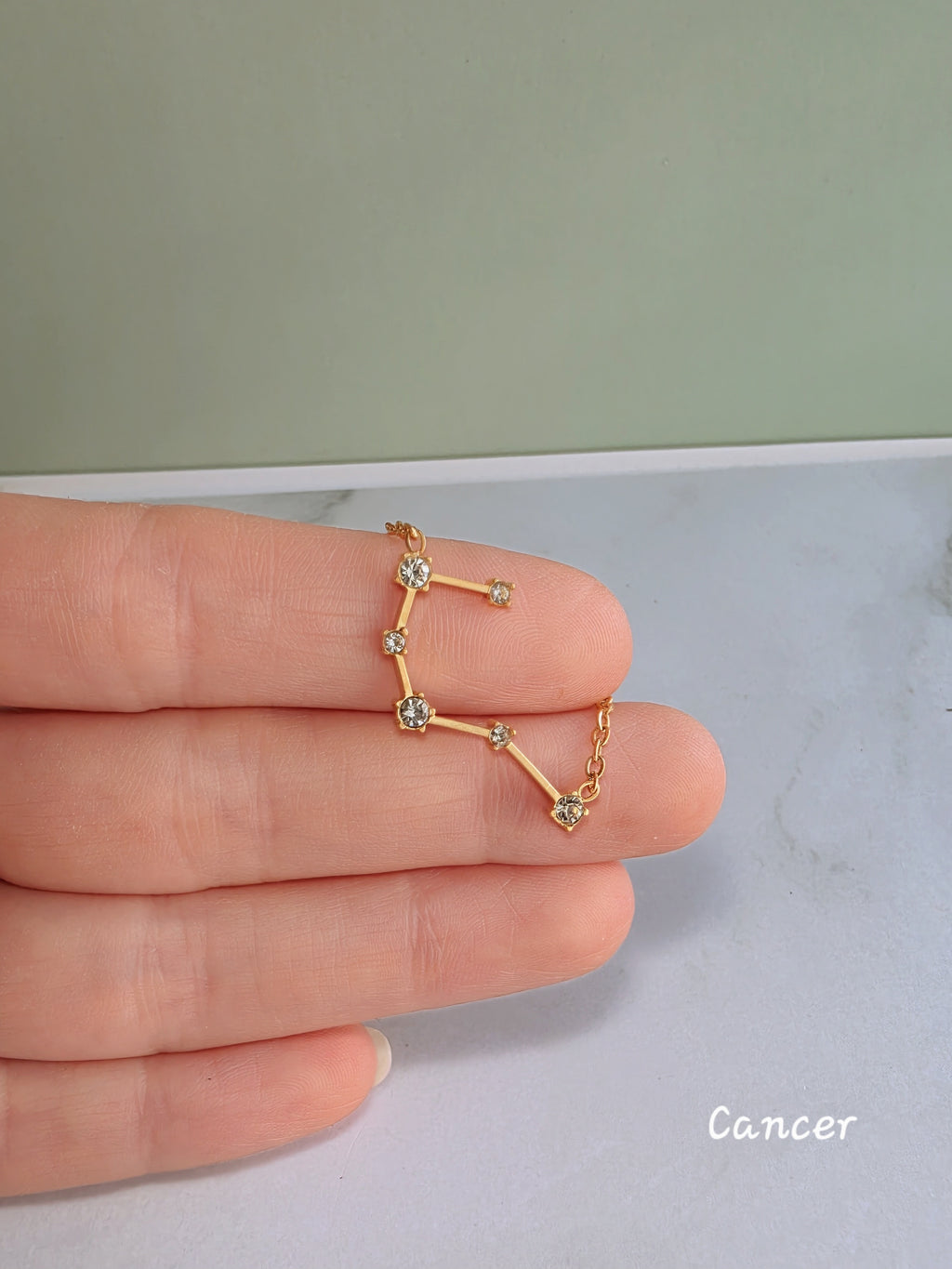Celestial astrology necklace featuring a zodiac constellation pendant.
