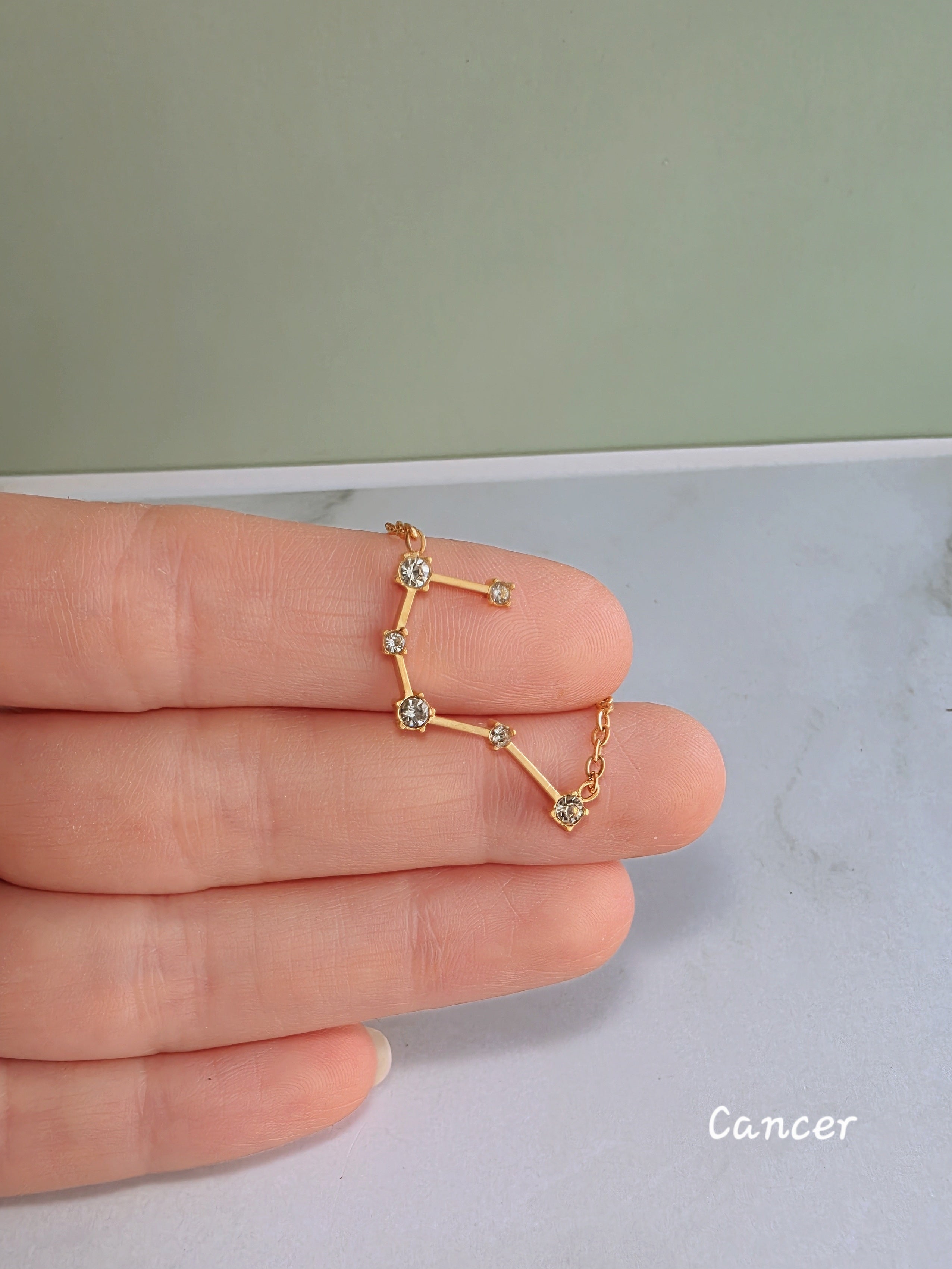 Celestial astrology necklace featuring a zodiac constellation pendant.