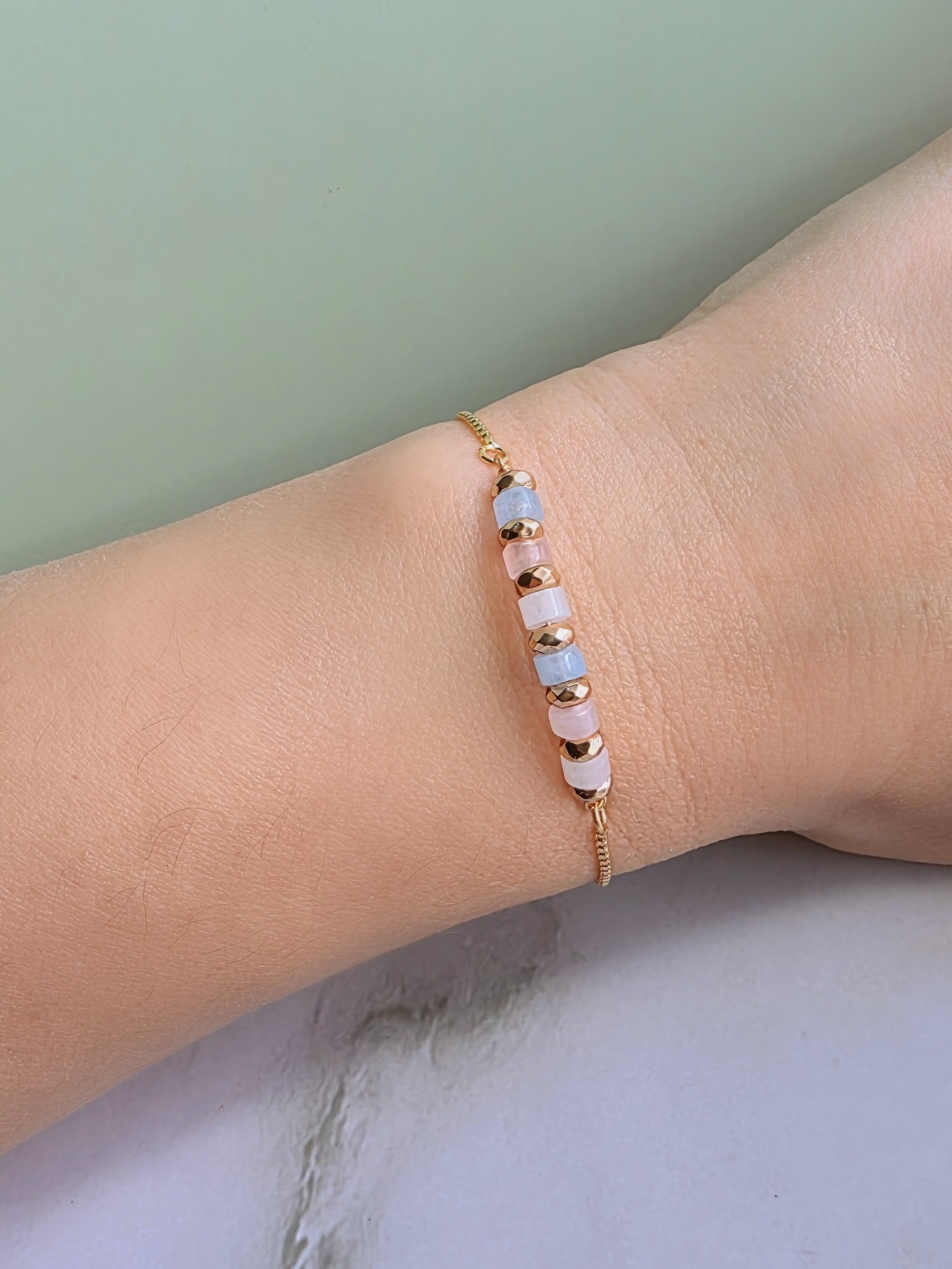 Gemstone fertility bracelet with natural Moonstone, Aquamarine, and Rose Quartz options.