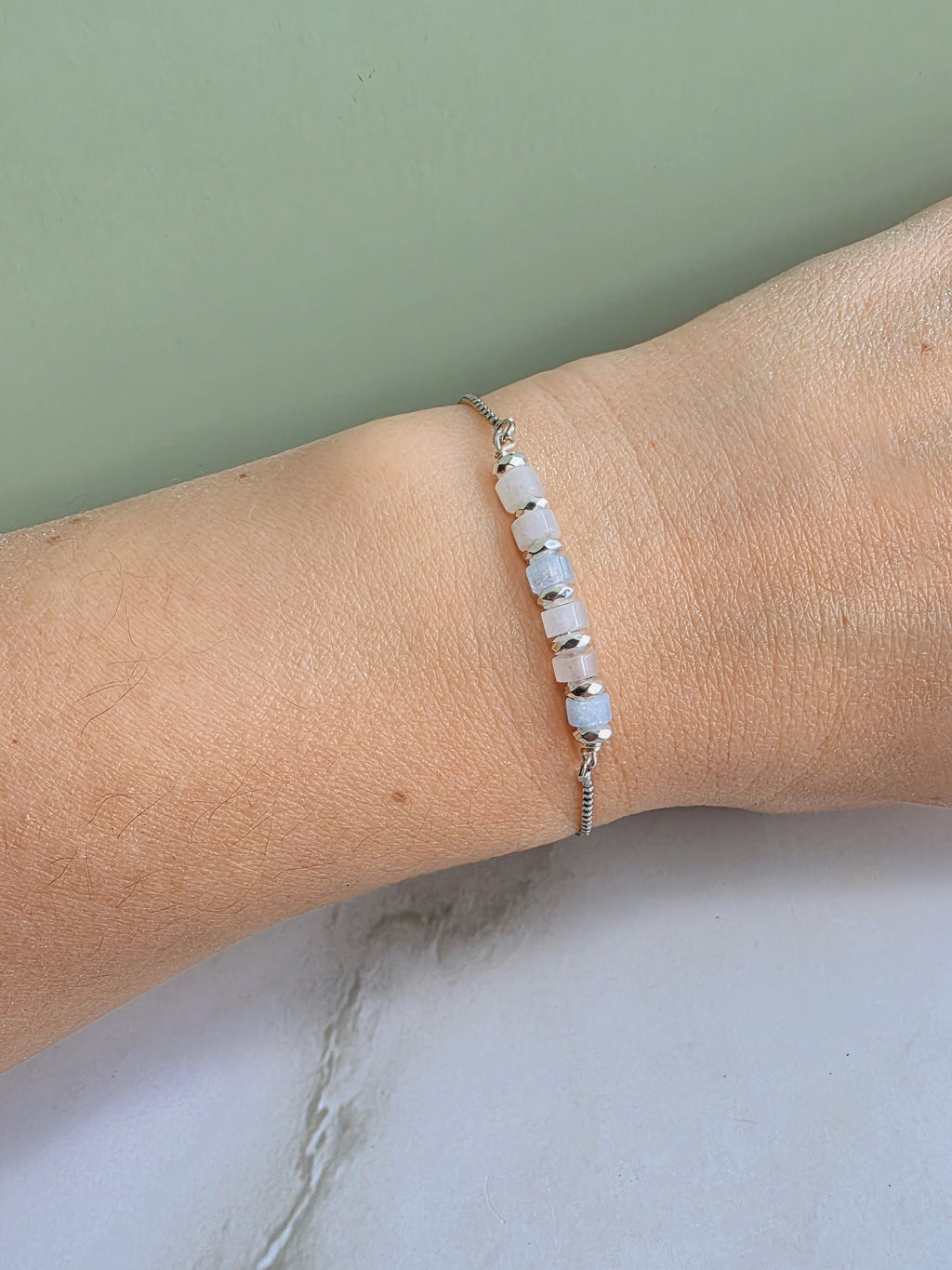 Adjustable crystal bracelet featuring meaningful gemstone options.