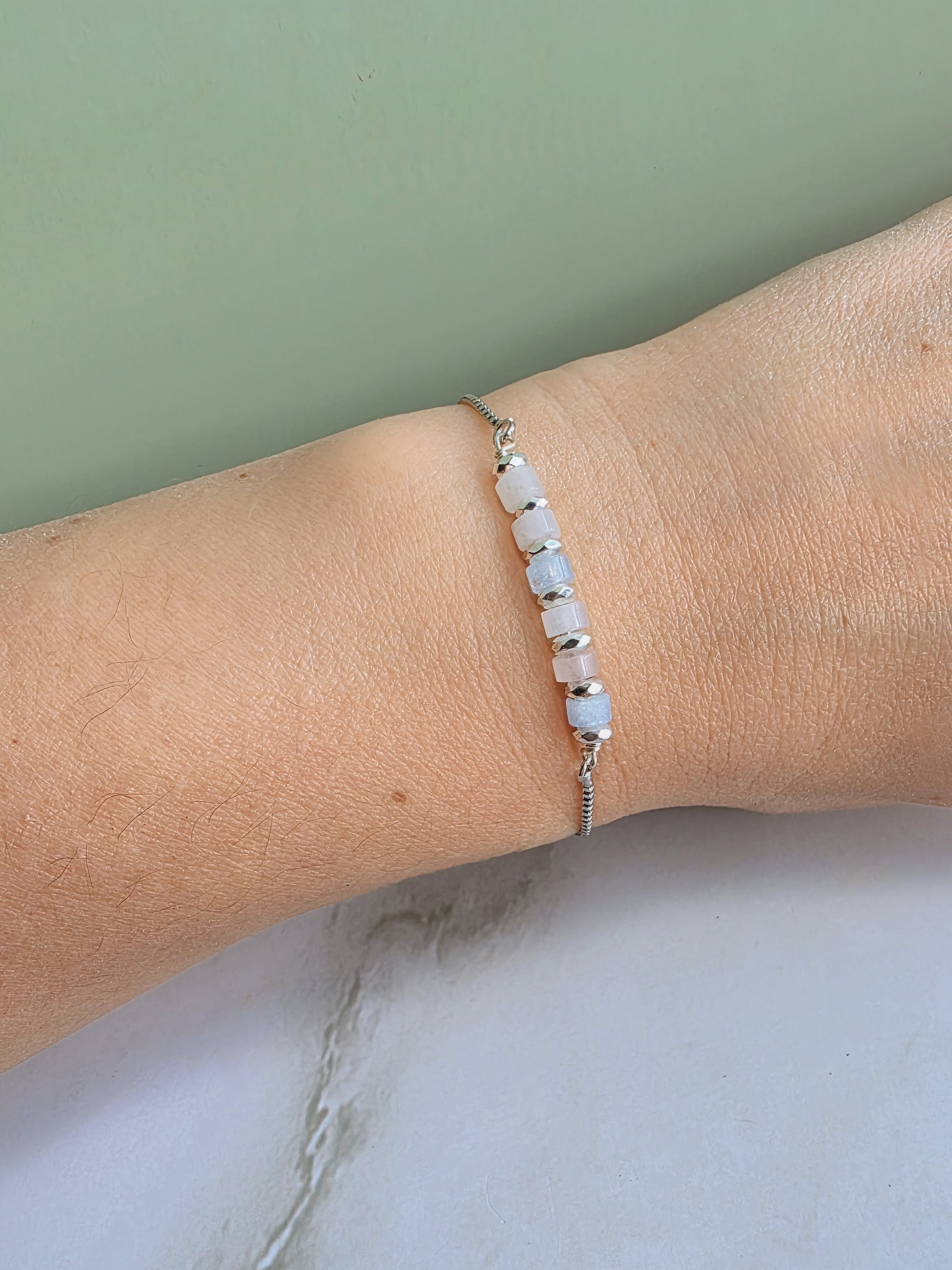 Adjustable crystal bracelet featuring meaningful gemstone options.