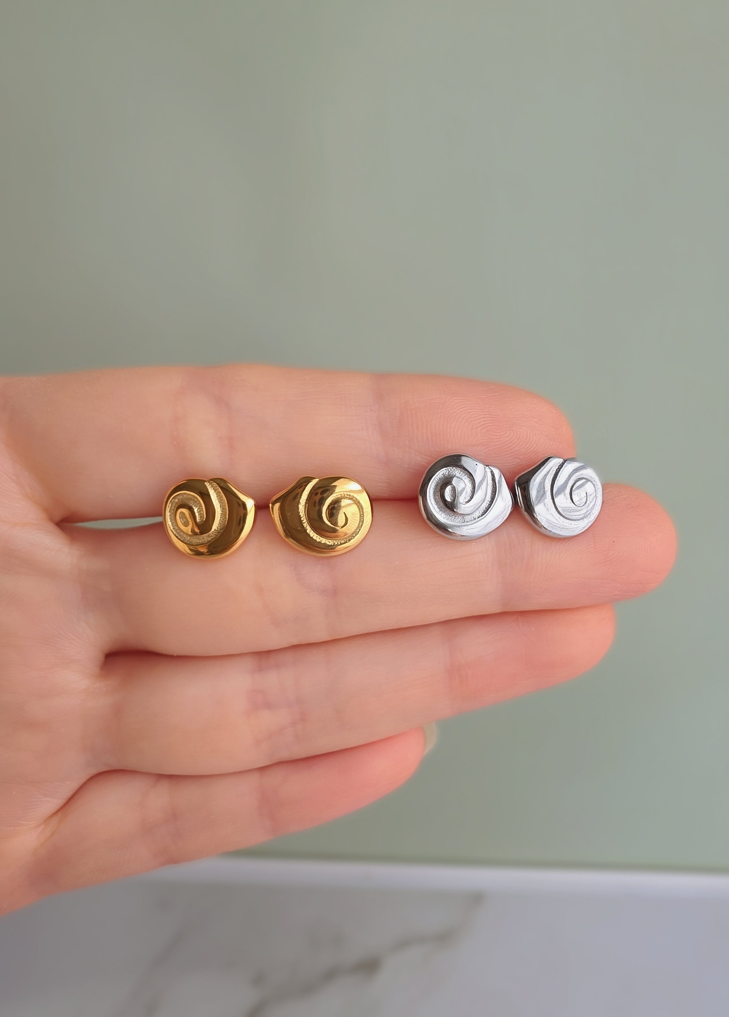 Modern spiral earrings with a polished 18K gold-plated finish.