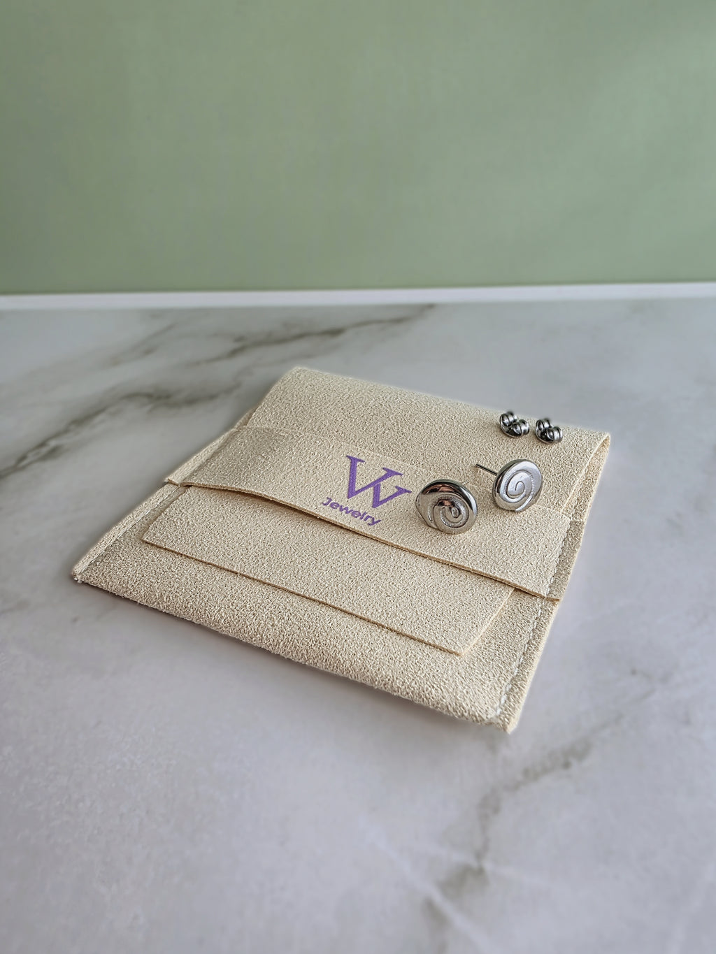 Modern gold spiral earrings with a polished finish.