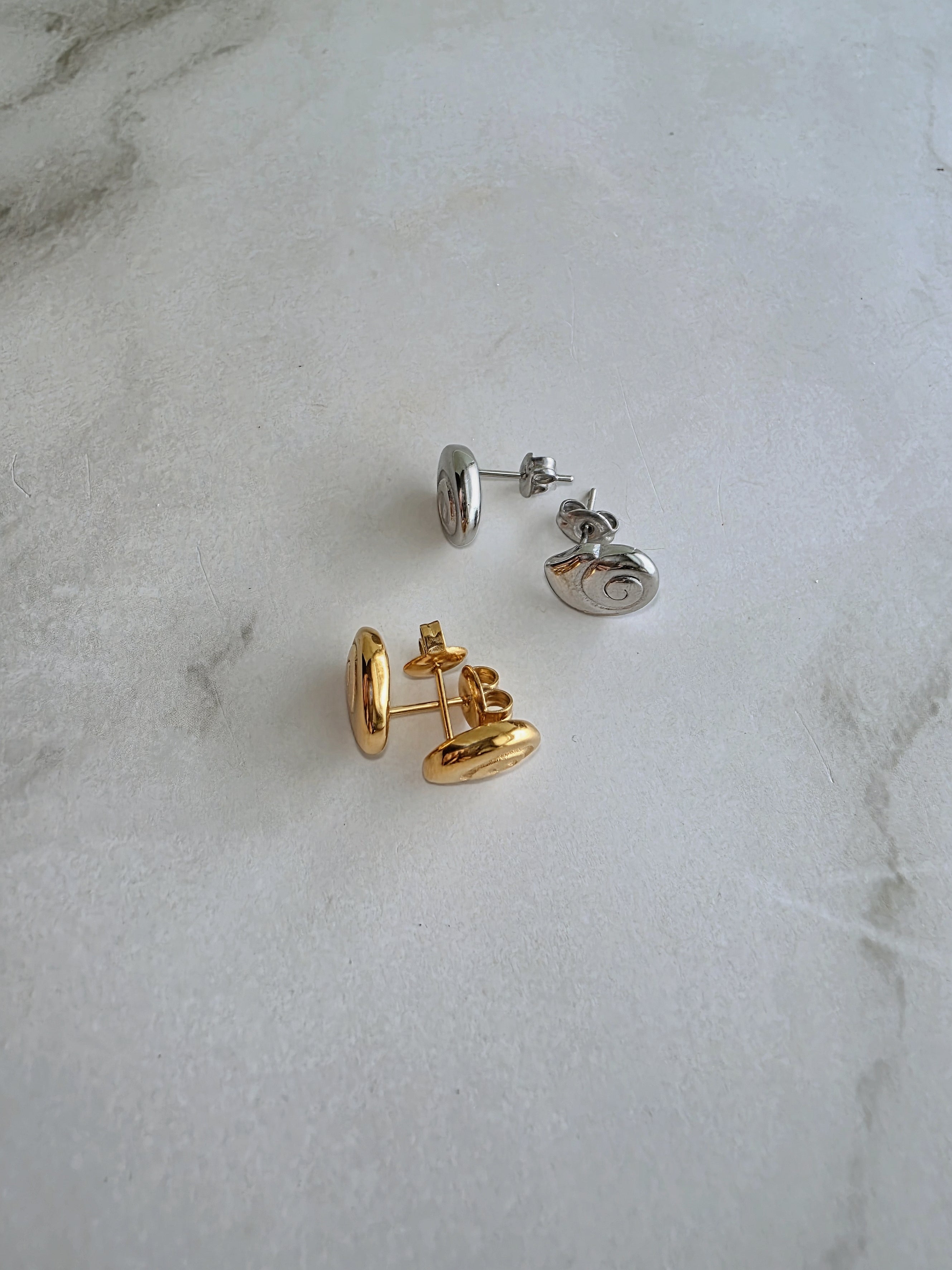 Lightweight spiral stud earrings with a timeless sculptural design.