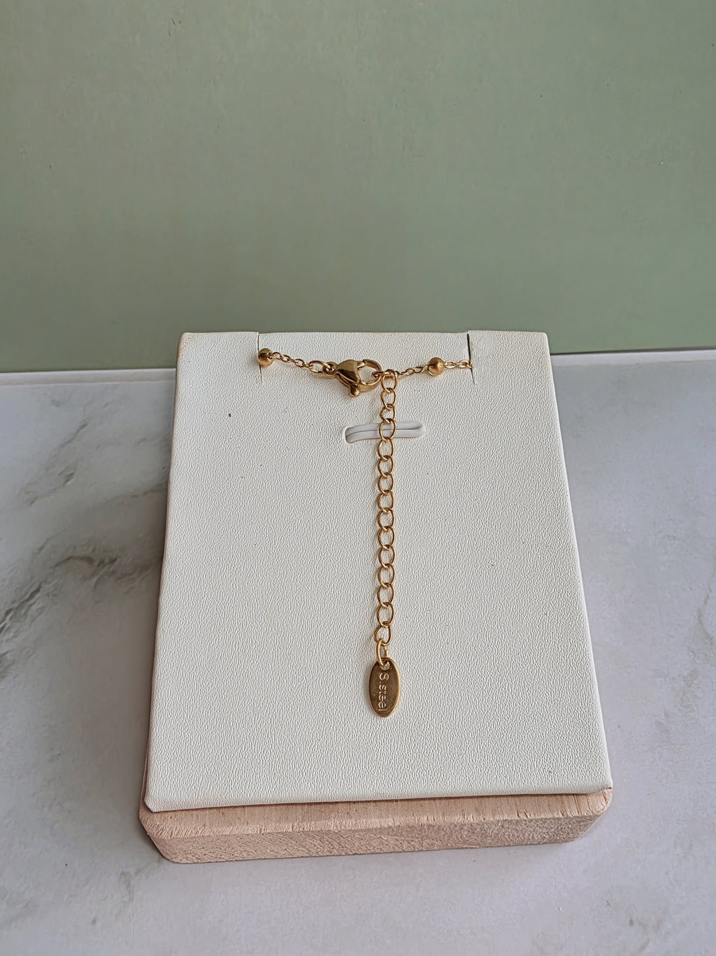 Gold clover choker with a matching layered Y necklace.