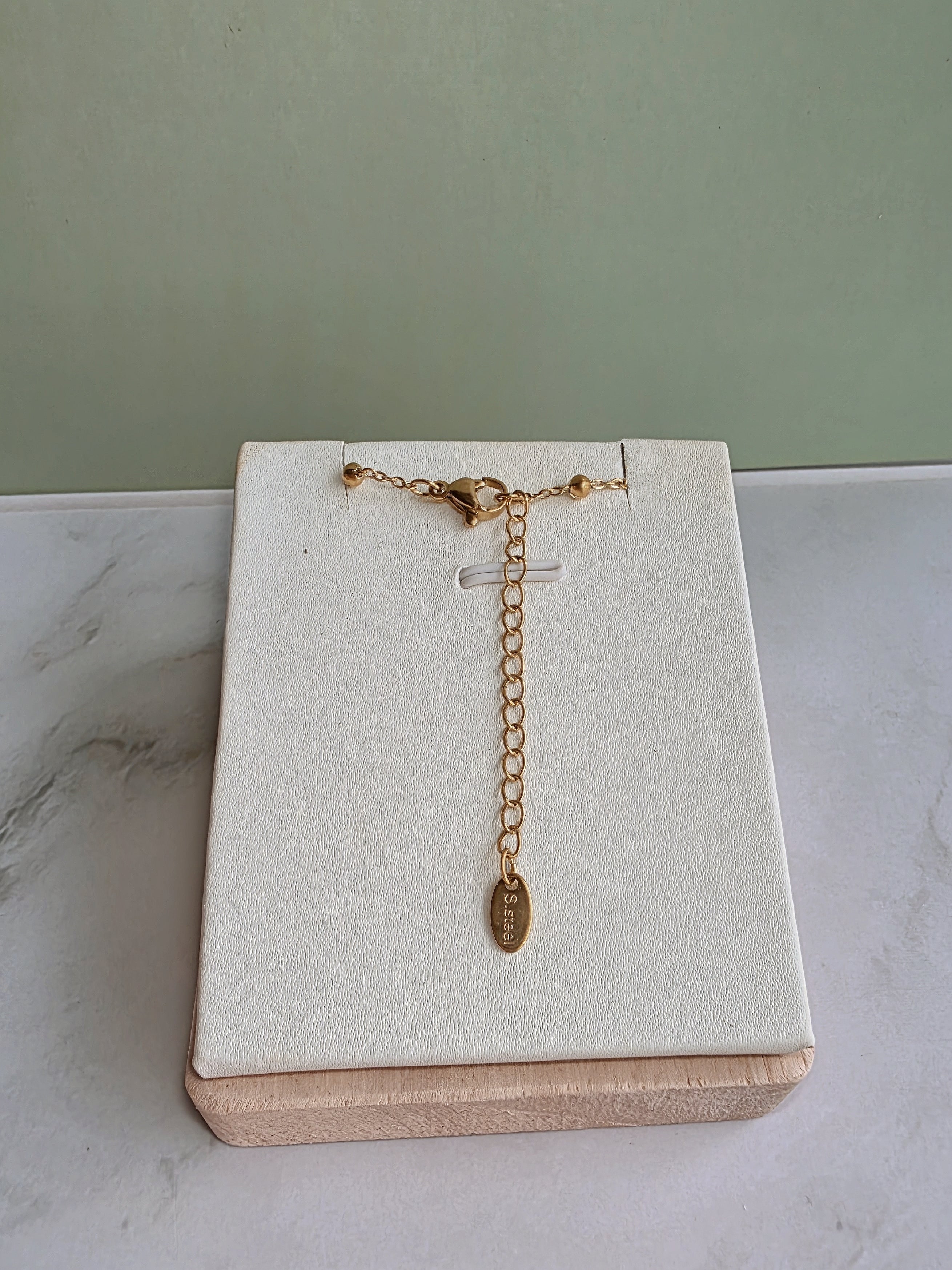 Gold clover choker with a matching layered Y necklace.