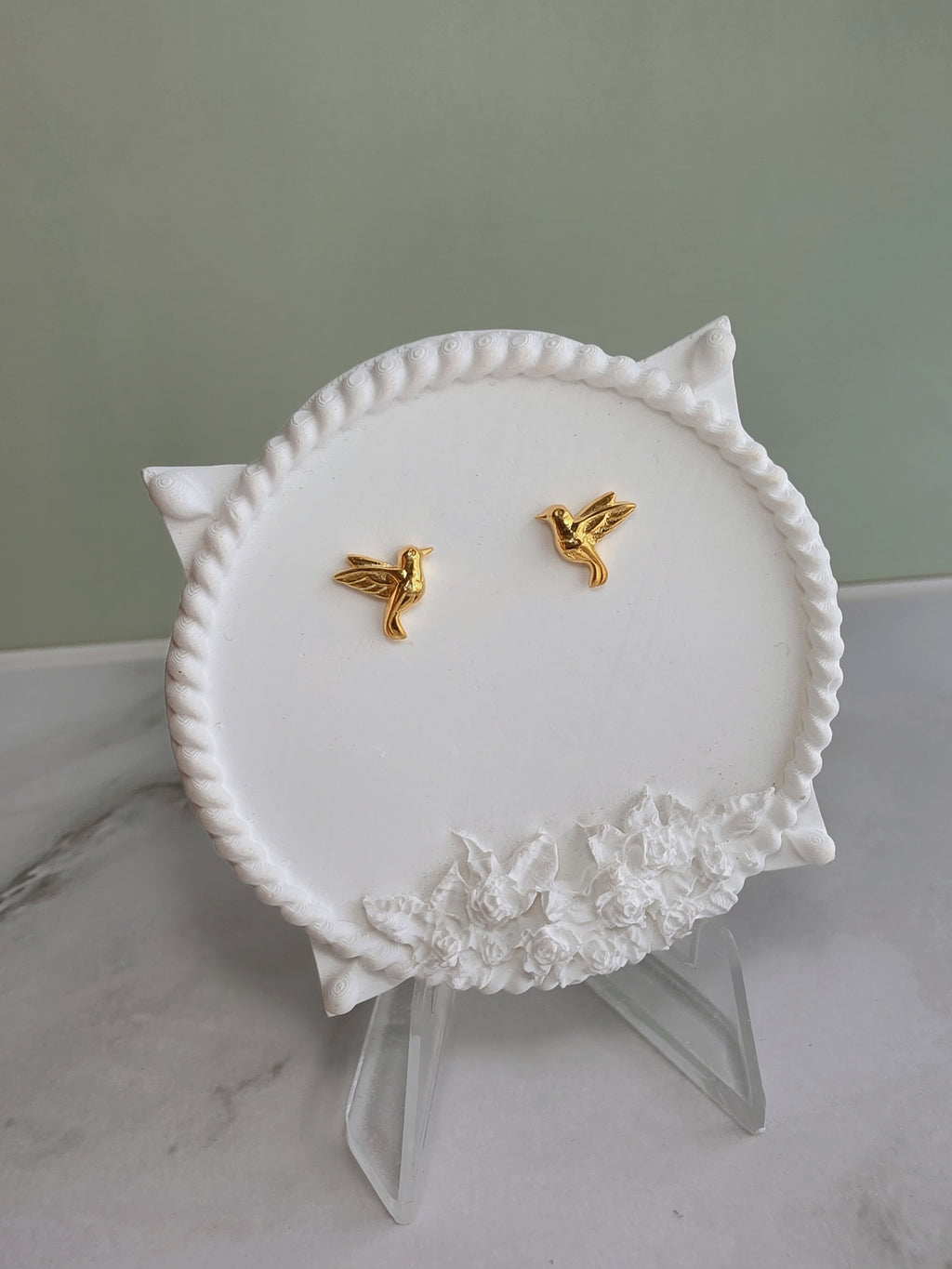 Gold hummingbird stud earrings for everyday wear.