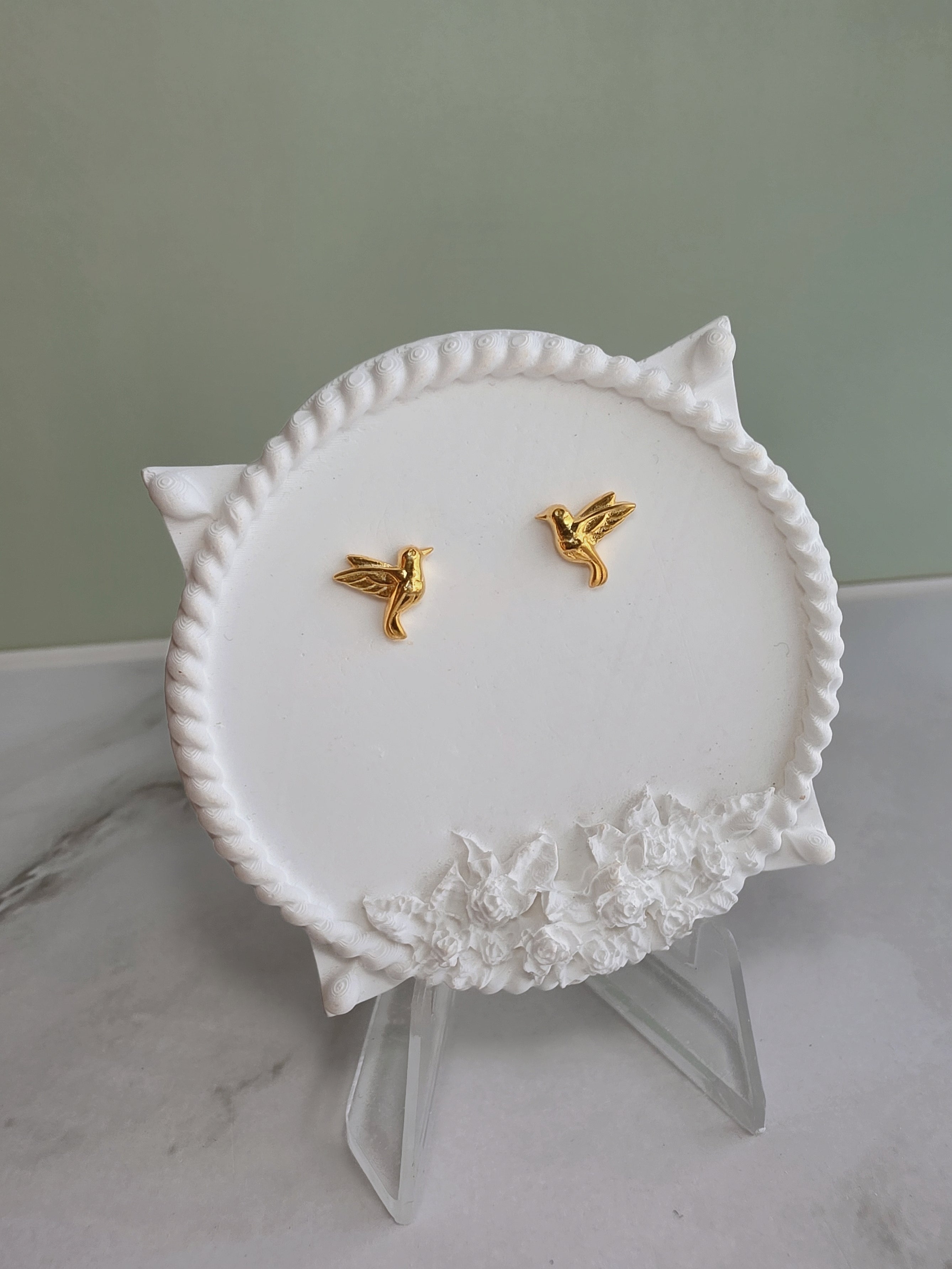 Gold hummingbird stud earrings for everyday wear.