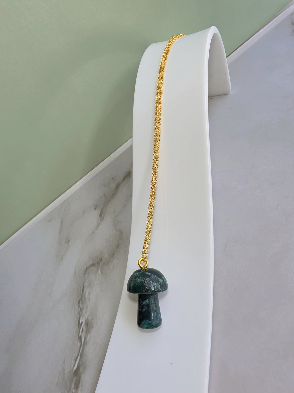 Nature-inspired mushroom necklace featuring a carved Moss Agate pendant.