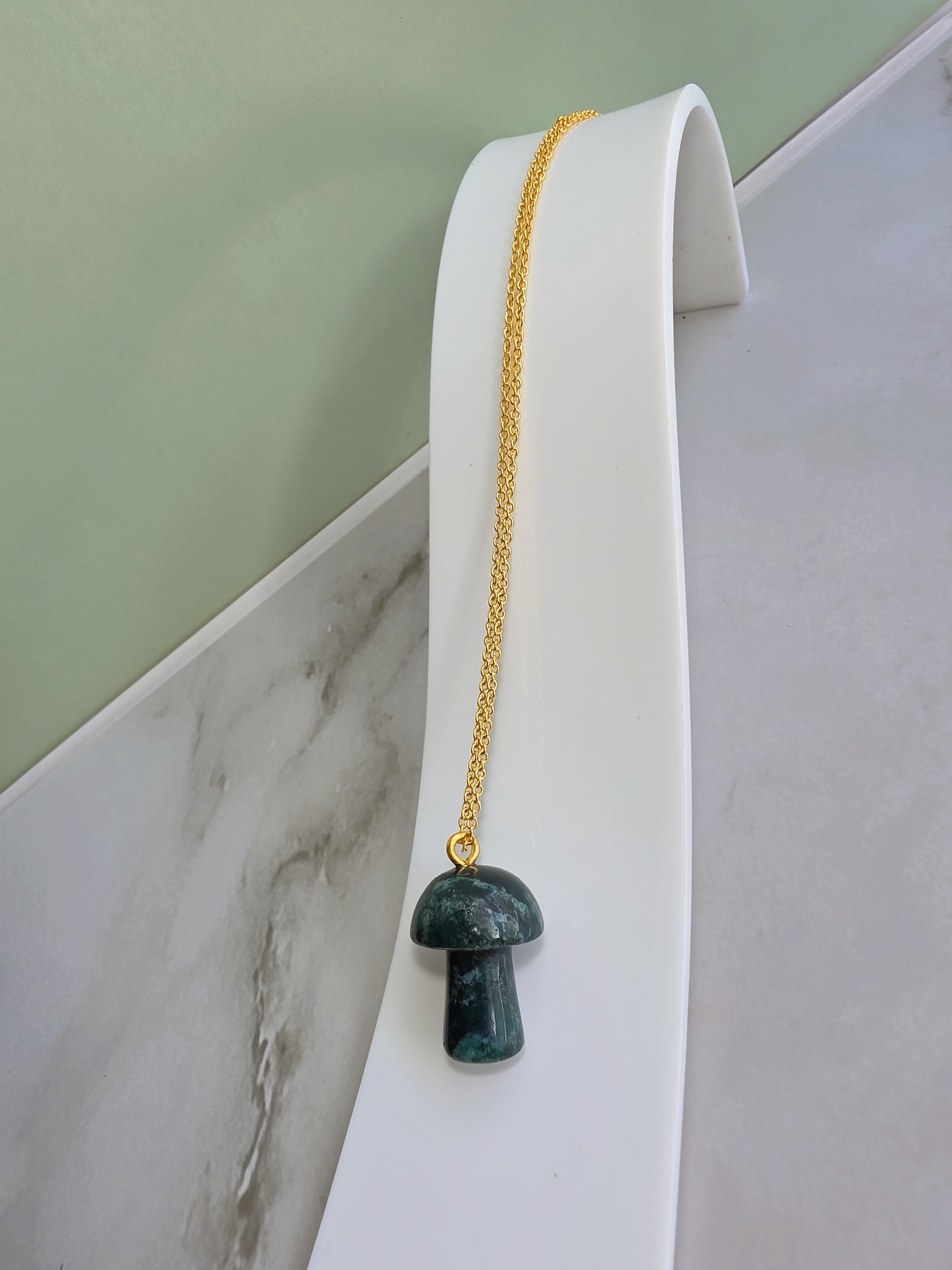 Nature-inspired mushroom necklace featuring a carved Moss Agate pendant.