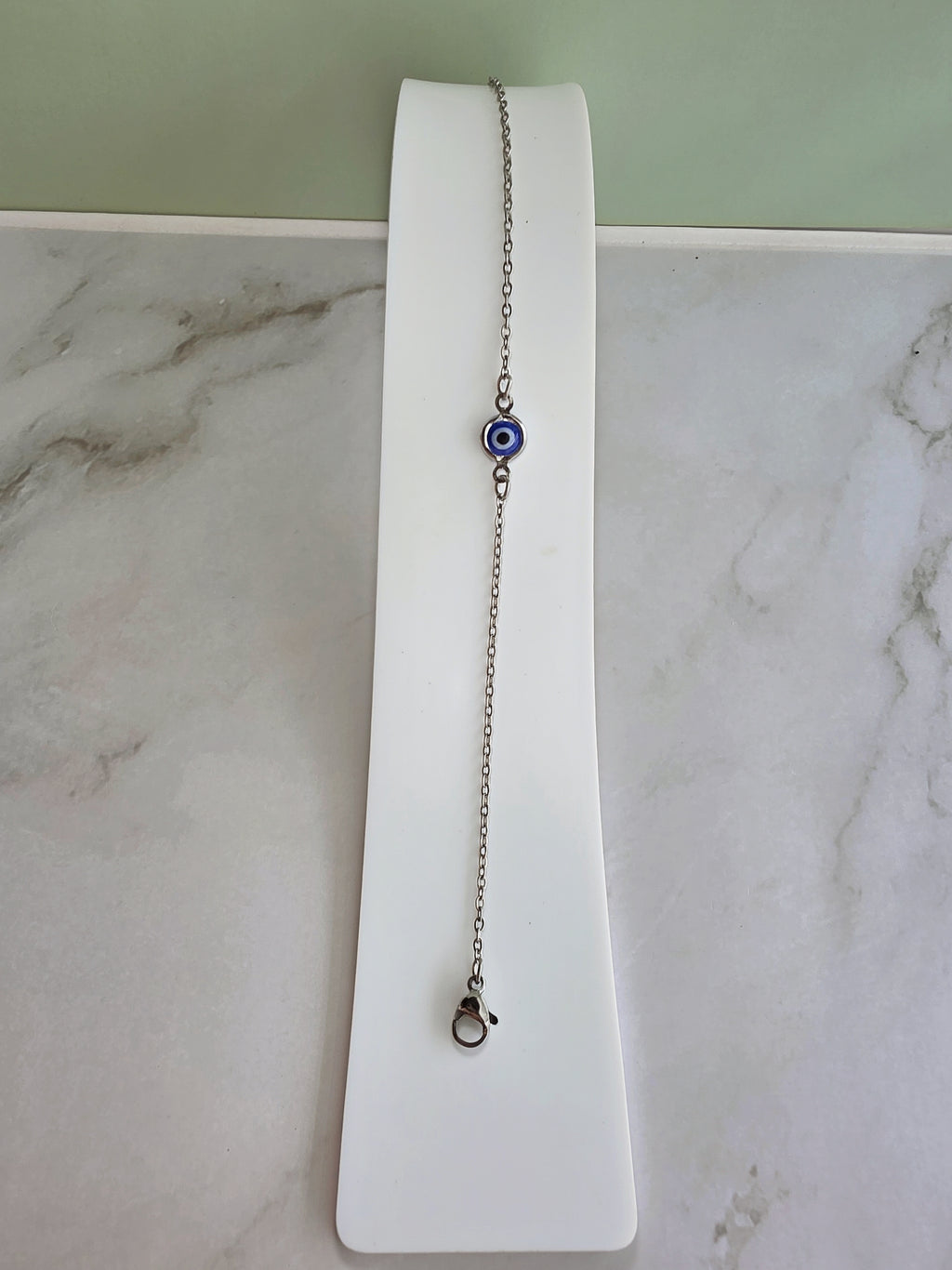 Elegant adjustable Evil Eye bracelet in gold or silver for gifting.