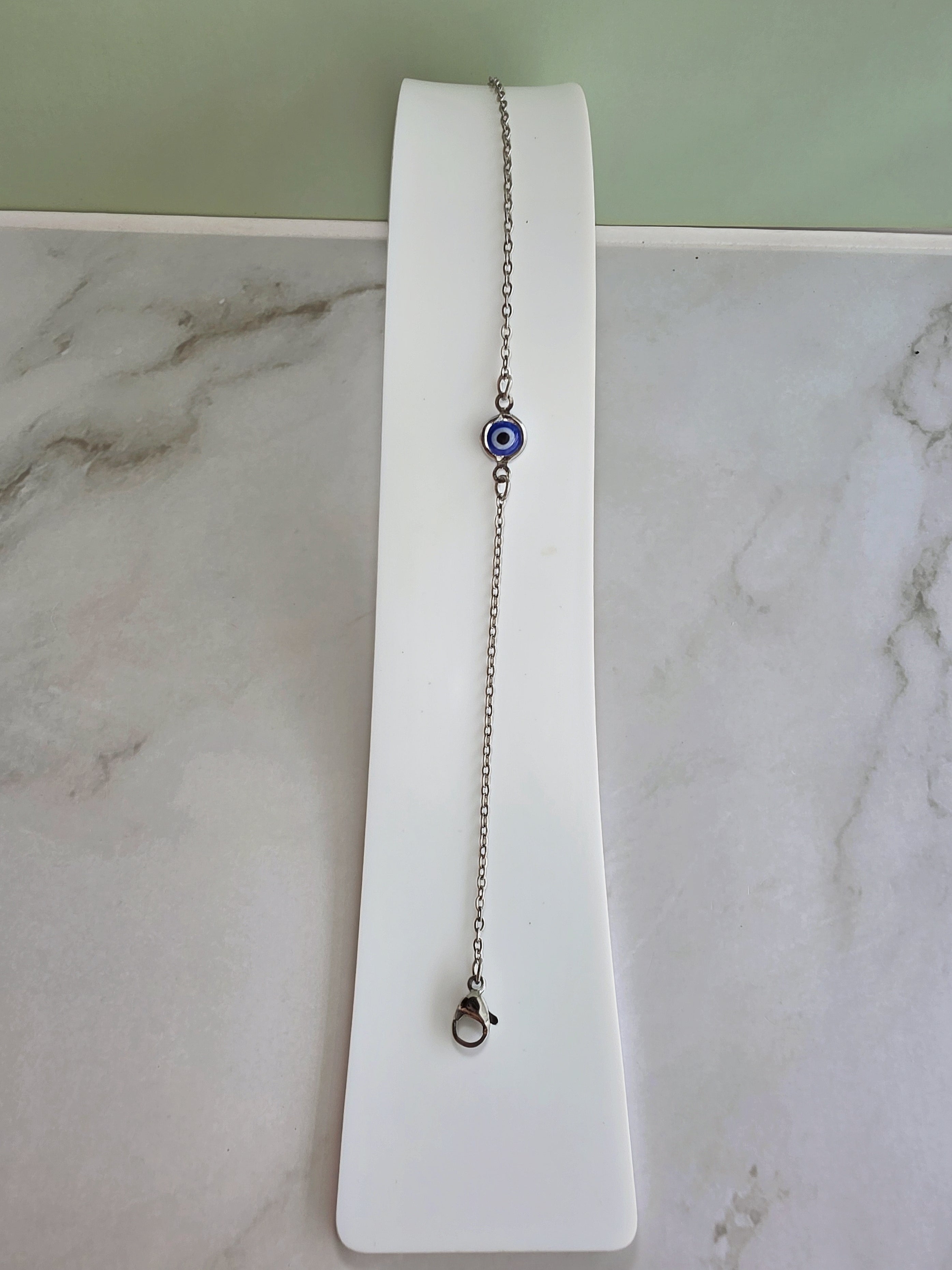 Elegant adjustable Evil Eye bracelet in gold or silver for gifting.