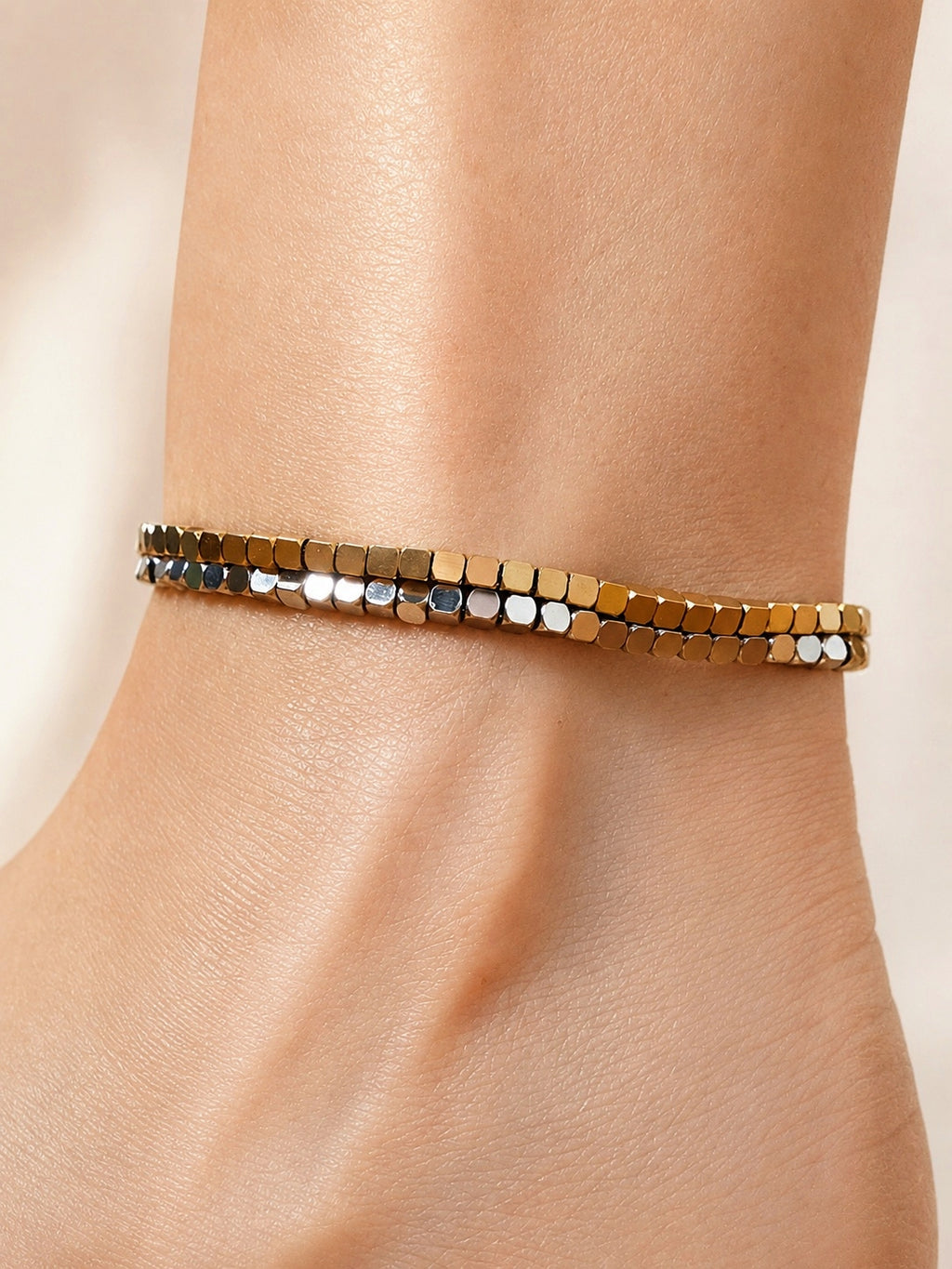 Dainty beaded anklet with a 14K gold-plated non-tarnish finish.
