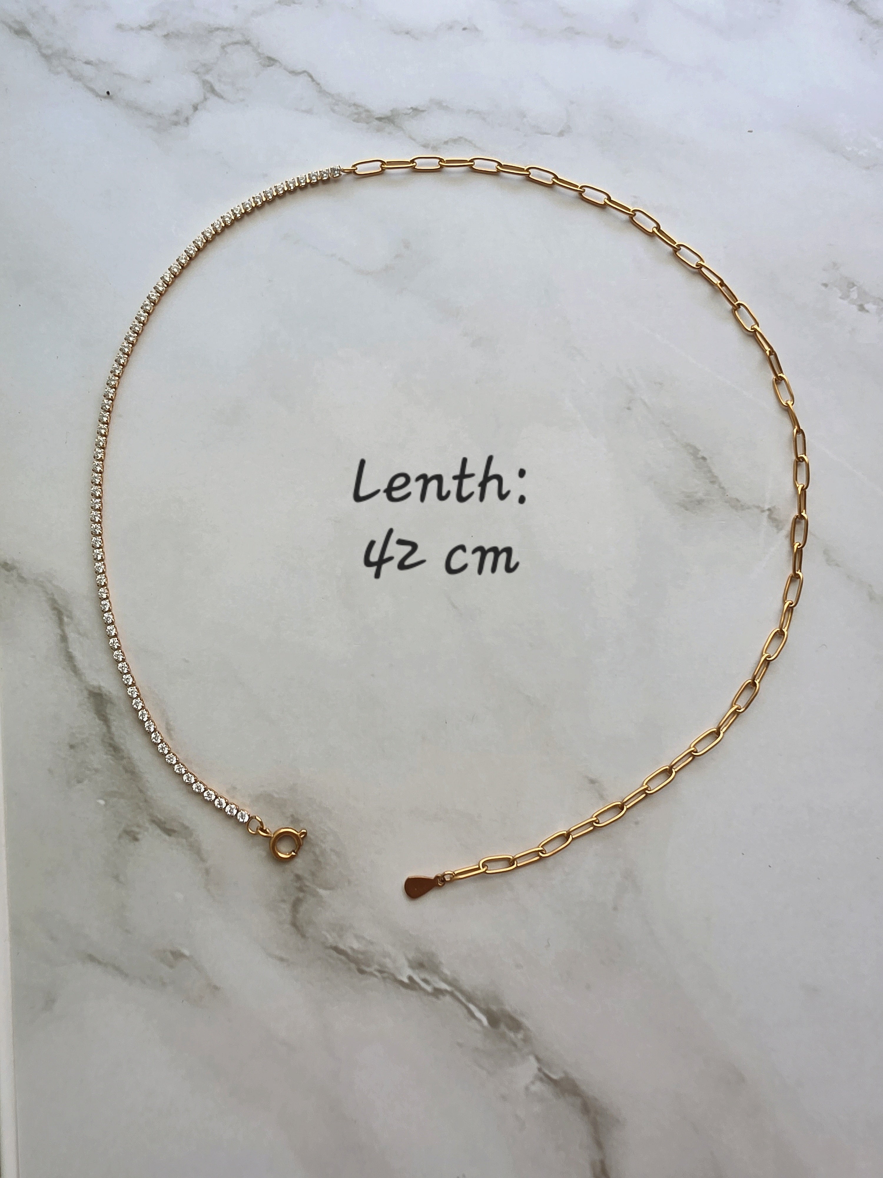 Non-tarnish gold paperclip chain choker featuring a delicate tennis necklace design.