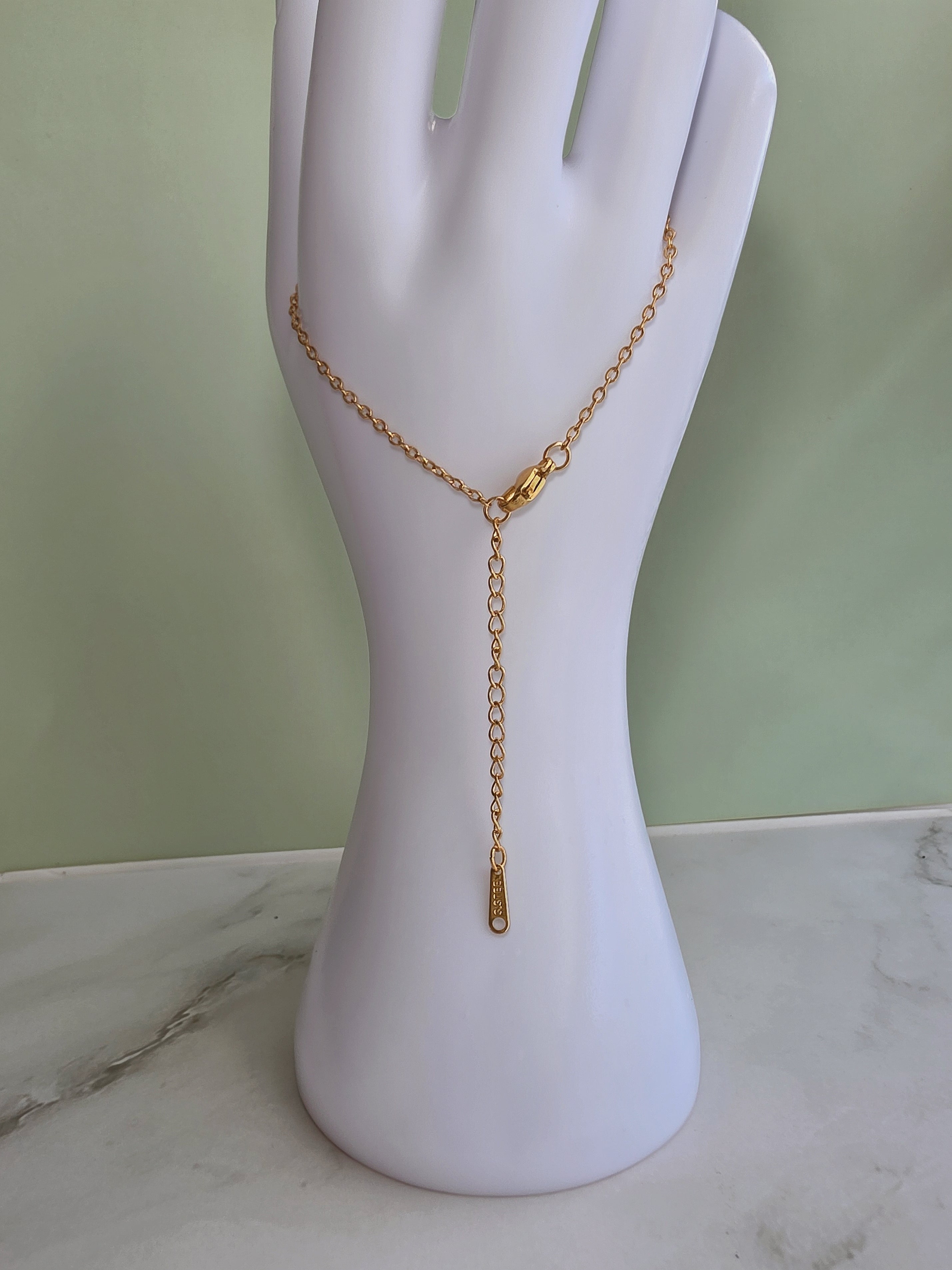 Beach jewelry necklace with a genuine seashell pendant and gold-plated chain.