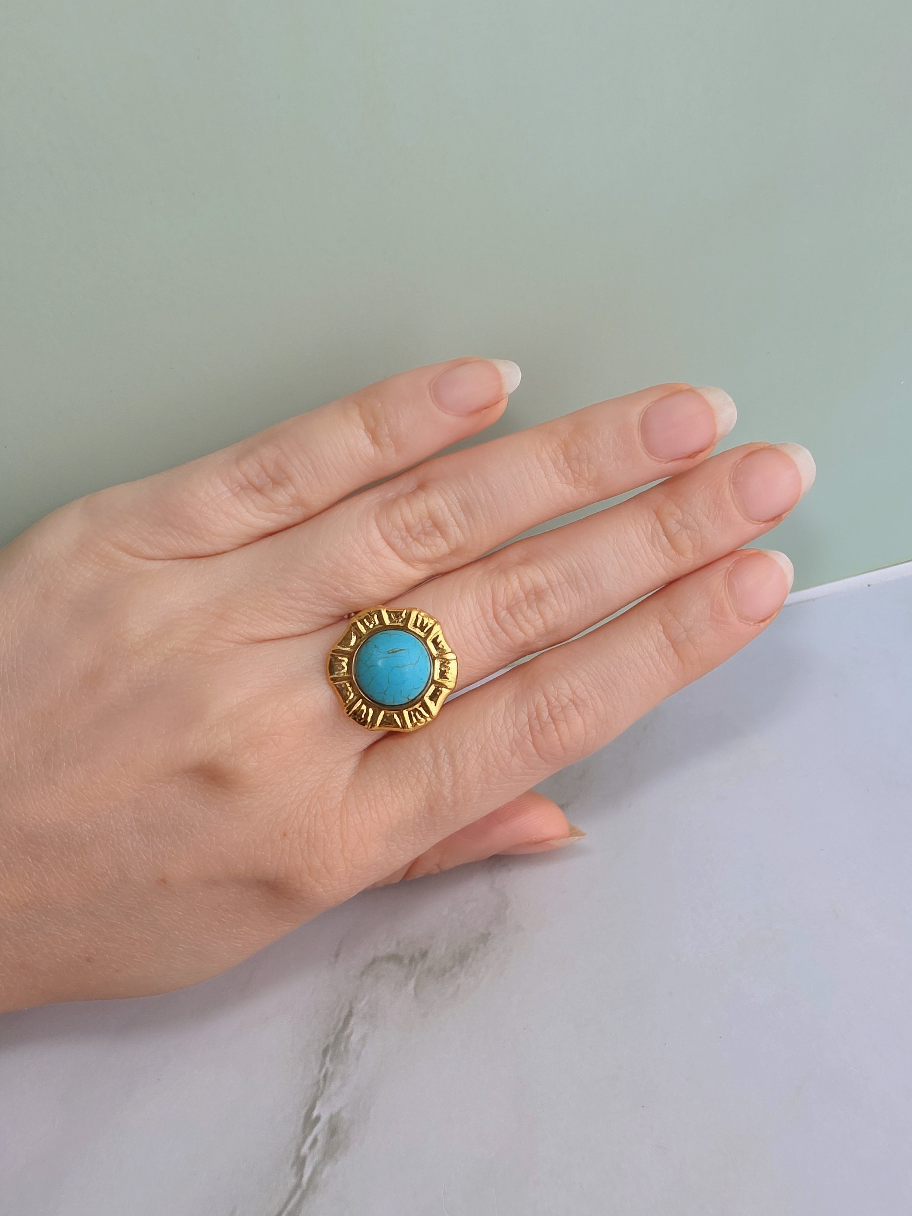 Bold turquoise statement ring inspired by vintage western jewelry.