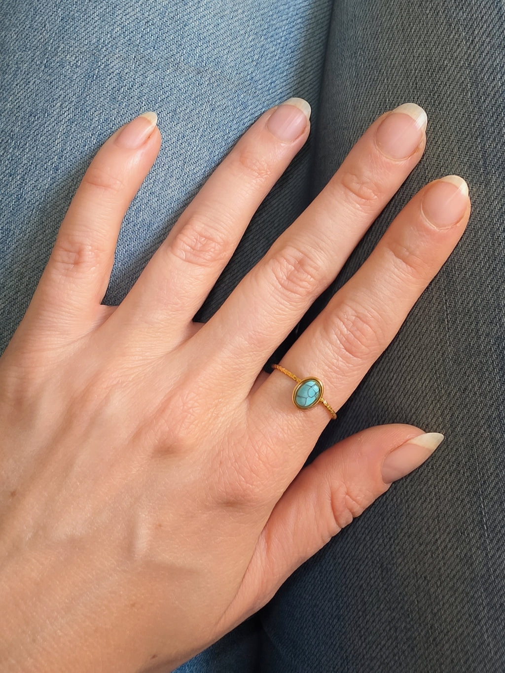 Women's turquoise gemstone ring with a durable non-tarnish gold finish.