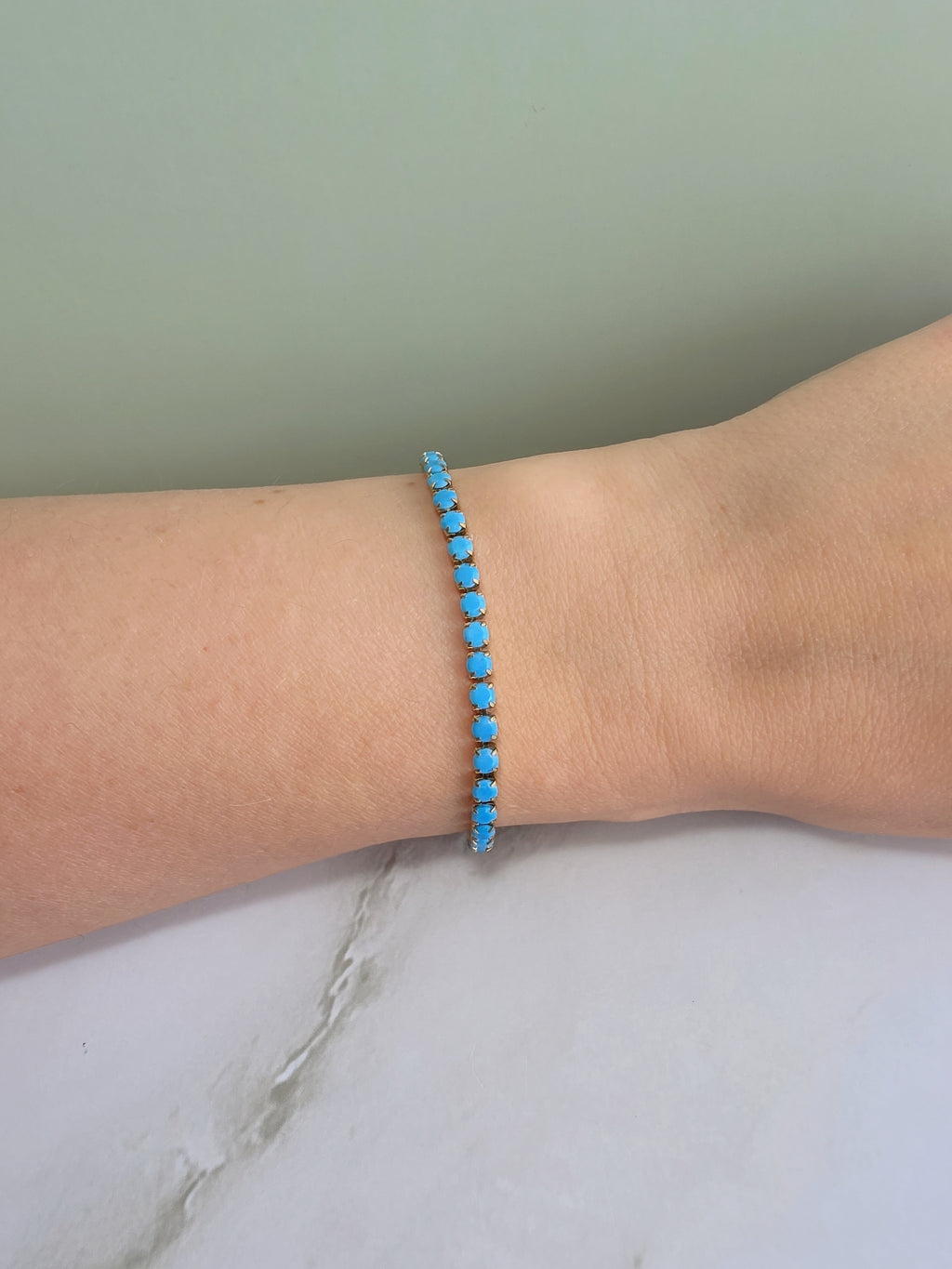 Elegant turquoise-colored tennis bracelet for everyday wear.