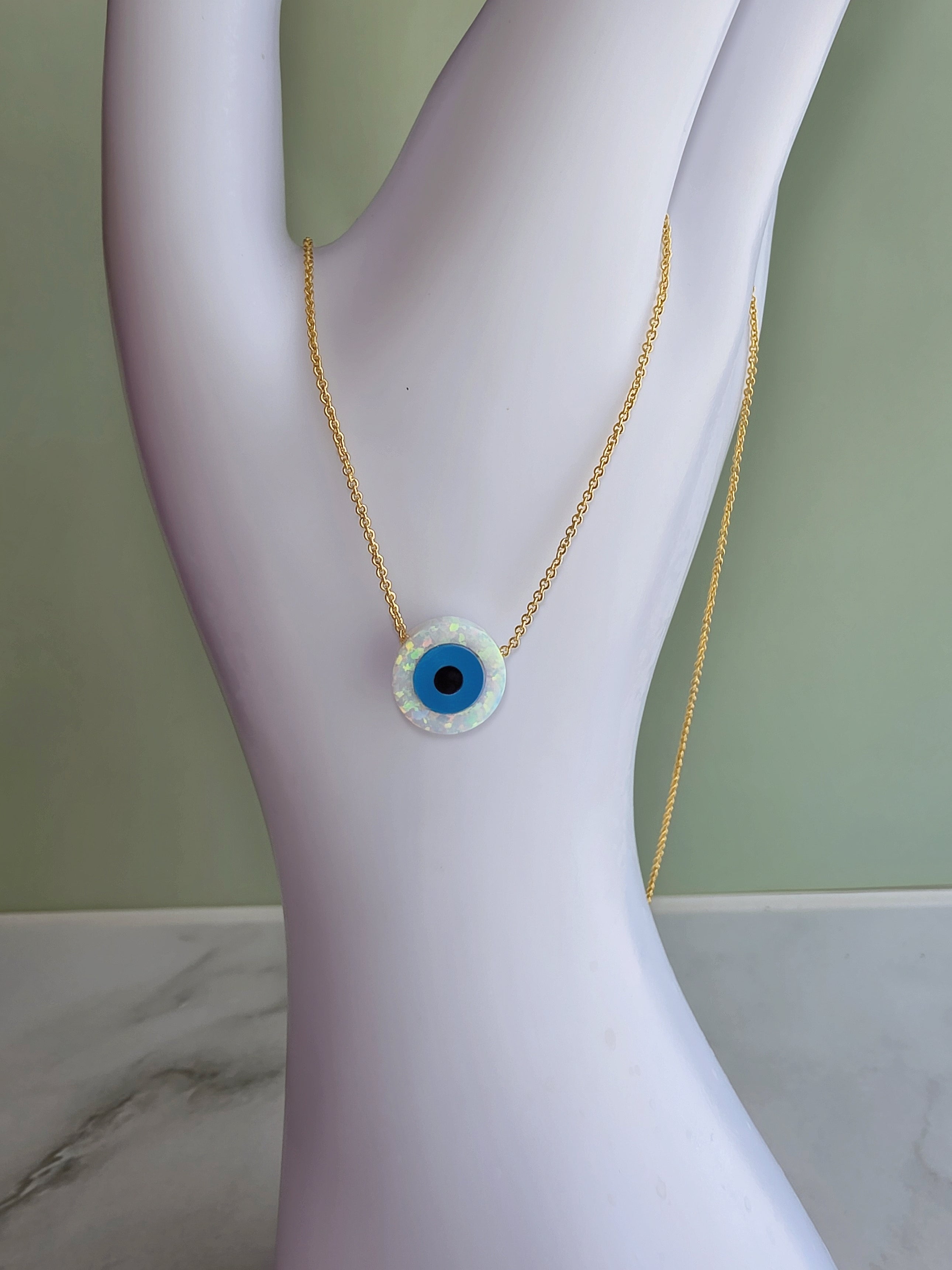 18K gold-plated evil eye necklace with a lab-created opal pendant.