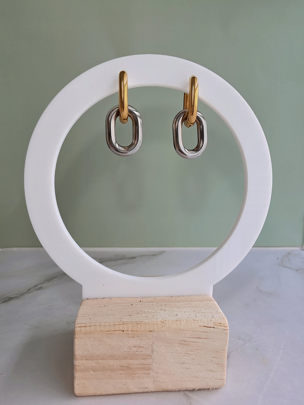 Modern gold and silver huggie earrings with a non tarnish finish.